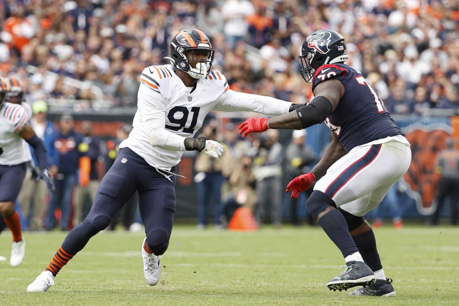 Chicago Bears defensive end Dominique Robinson (91) defends against Houston Texans offensive tackle Laremy Tunsil (78) during the second half of an NFL football game, Sunday, Sept. 25, 2022, in Chicago. (AP Photo/Kamil Krzaczynski)