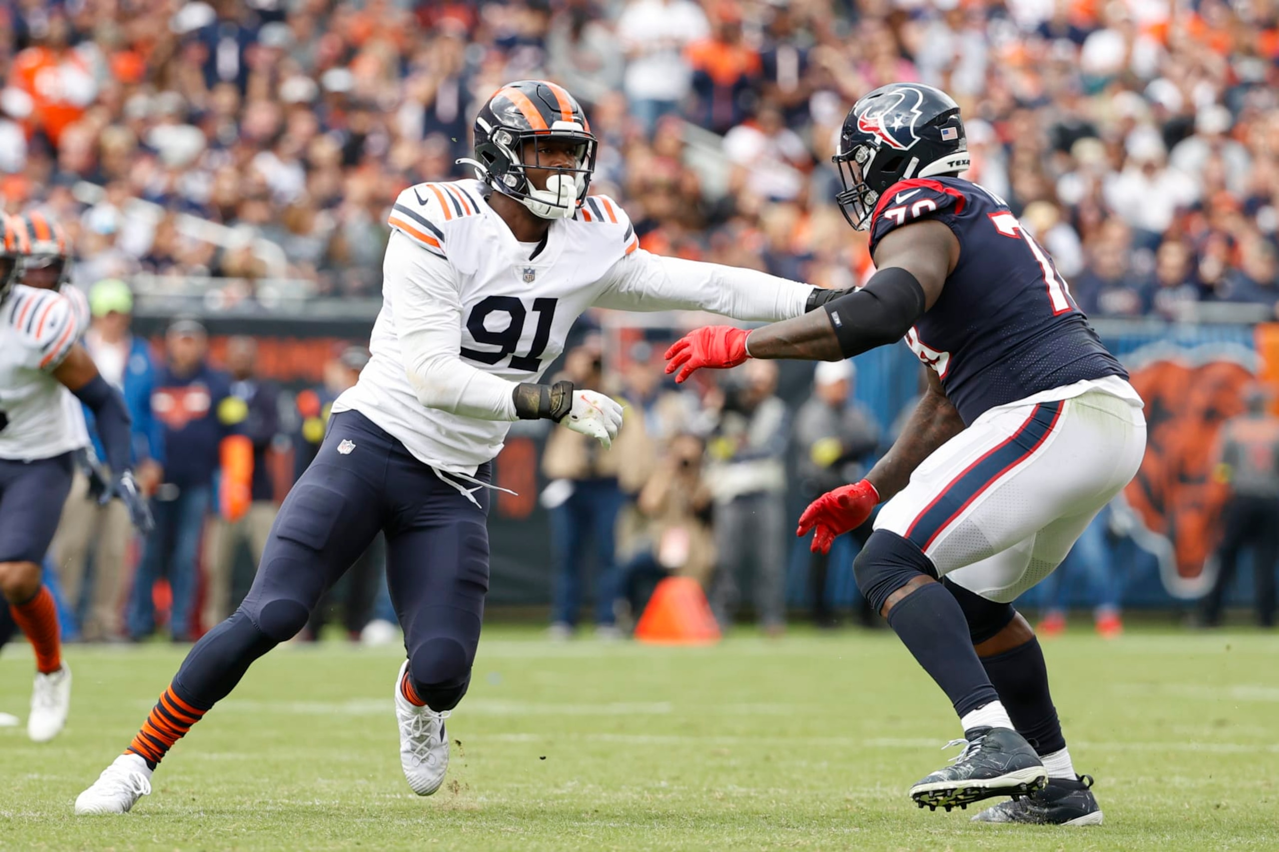 Chicago Bears defensive end Dominique Robinson (91) defends against Houston Texans offensive tackle Laremy Tunsil (78) during the second half of an NFL football game, Sunday, Sept. 25, 2022, in Chicago. (AP Photo/Kamil Krzaczynski)