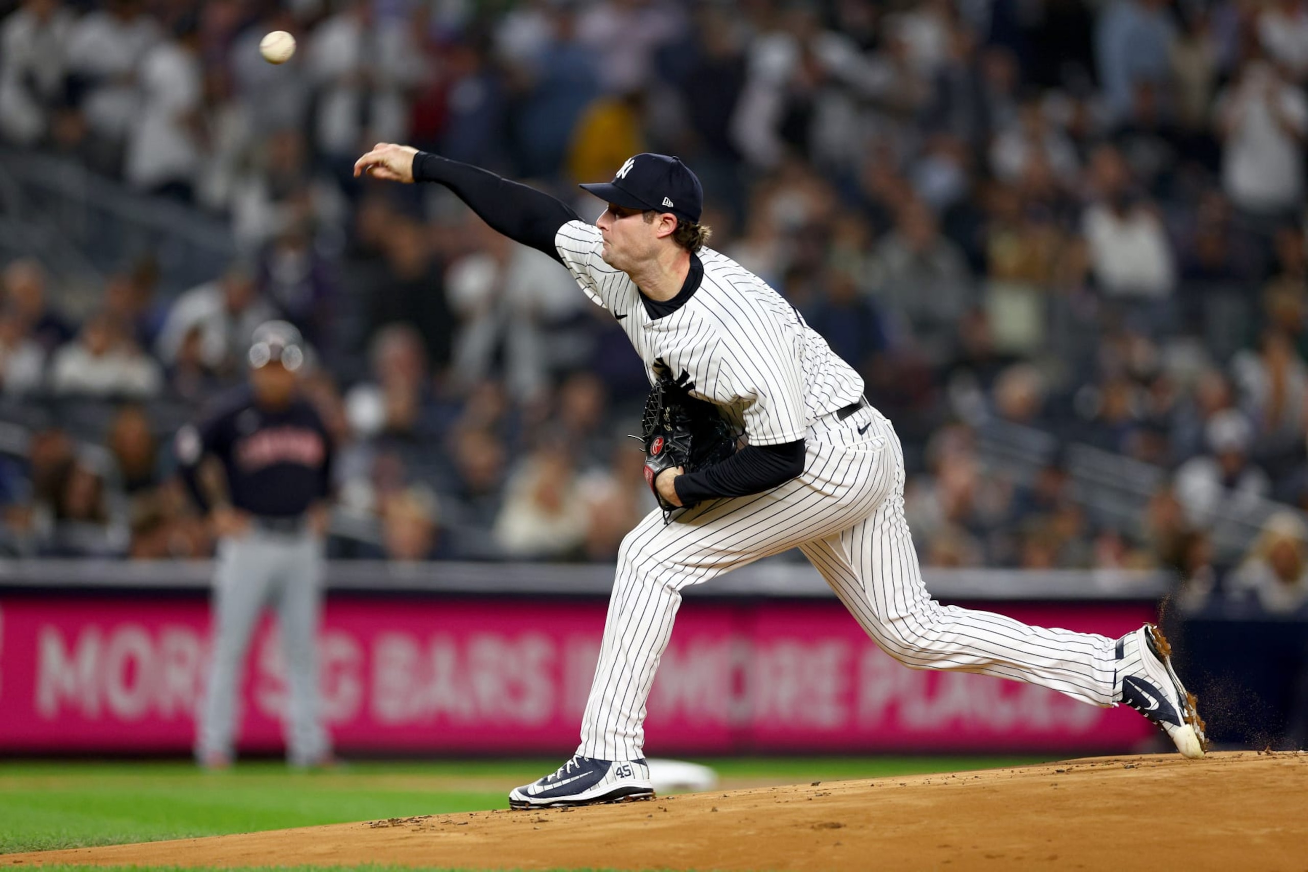 NEW YORK, NEW YORK - OCTOBER 11: Gerrit Cole #45 of the New York Yankees throws a pitch against the Cleveland Guardians during the first inning in game one of the American League Division Series at Yankee Stadium on October 11, 2022 in New York, New York. (Photo by Elsa/Getty Images)