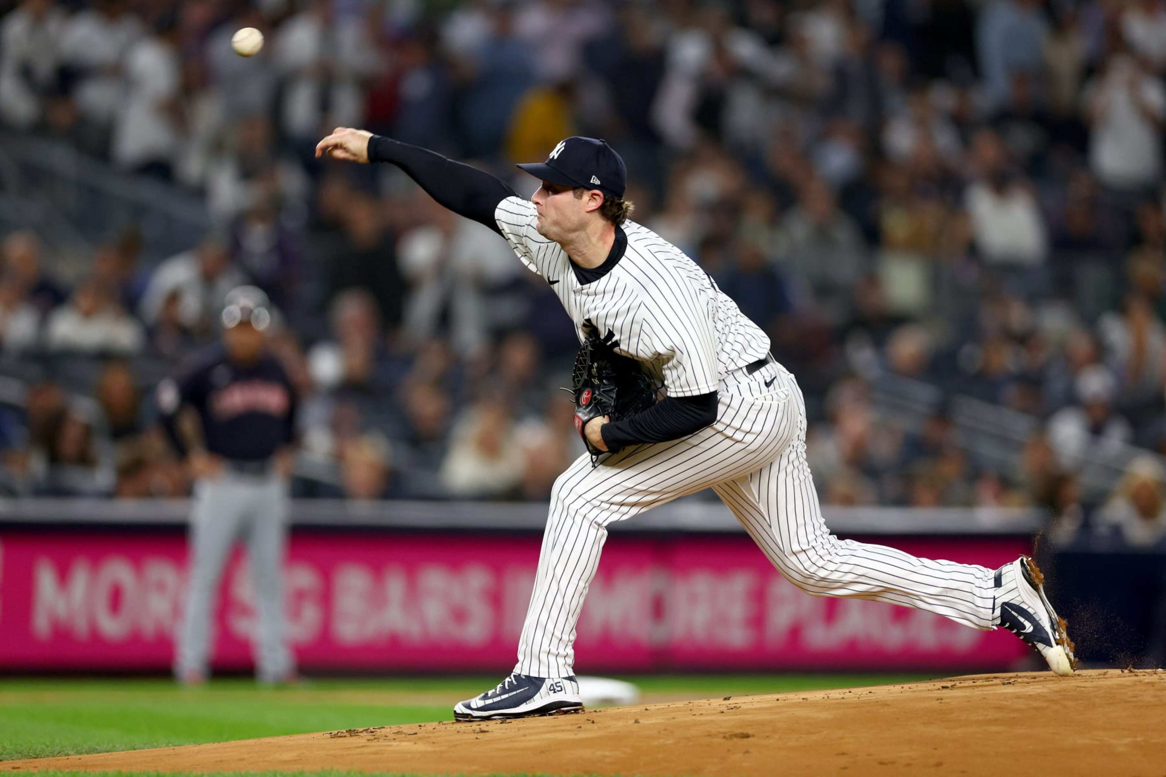 NEW YORK, NEW YORK - OCTOBER 11: Gerrit Cole #45 of the New York Yankees throws a pitch against the Cleveland Guardians during the first inning in game one of the American League Division Series at Yankee Stadium on October 11, 2022 in New York, New York. (Photo by Elsa/Getty Images)