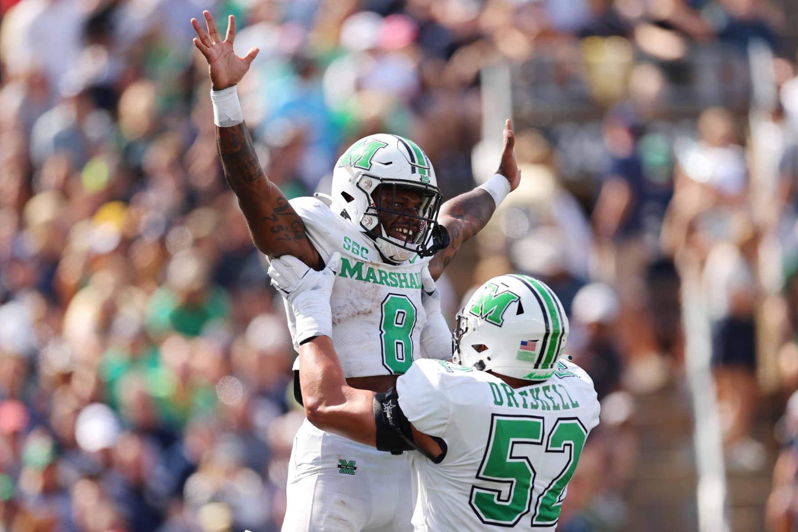 SOUTH BEND, INDIANA - SEPTEMBER 10: Khalan Laborn #8 of the Marshall Thundering Herd celebrates a touchdown with Ethan Driskell #52 against the Notre Dame Fighting Irish during the first half at Notre Dame Stadium on September 10, 2022 in South Bend, Indiana. (Photo by Michael Reaves/Getty Images)