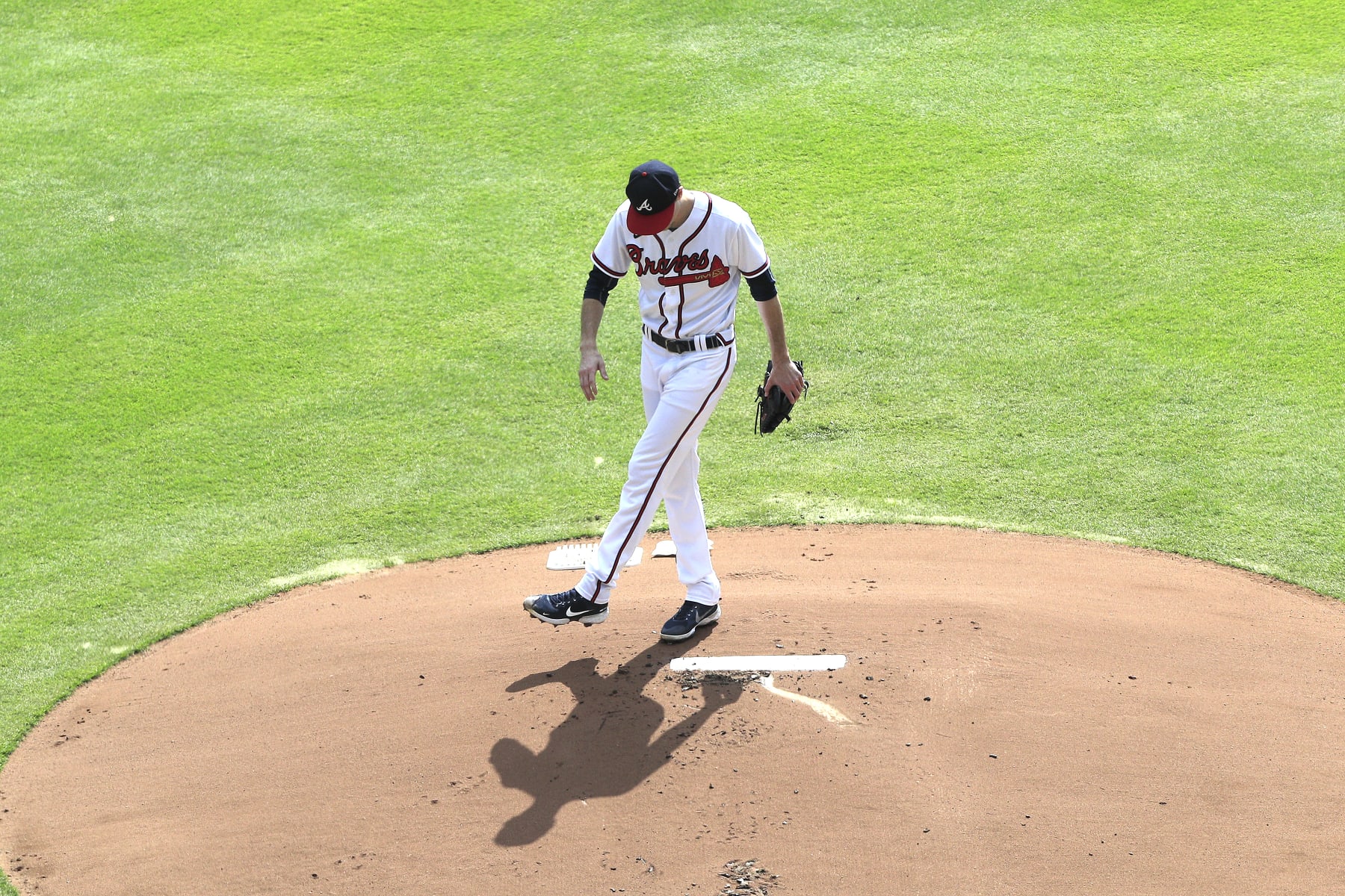 ATLANTA, GA - OCTOBER 11: Atlanta Braves starting pitcher Max Fried (54) kicks some dirt on the mound during Game 1 of the NLDS between the Atlanta Braves and the Philadephia Phillies on October 11, 2022 at Truist Park in Atlanta, Georgia.  (Photo by David J. Griffin/Icon Sportswire via Getty Images)