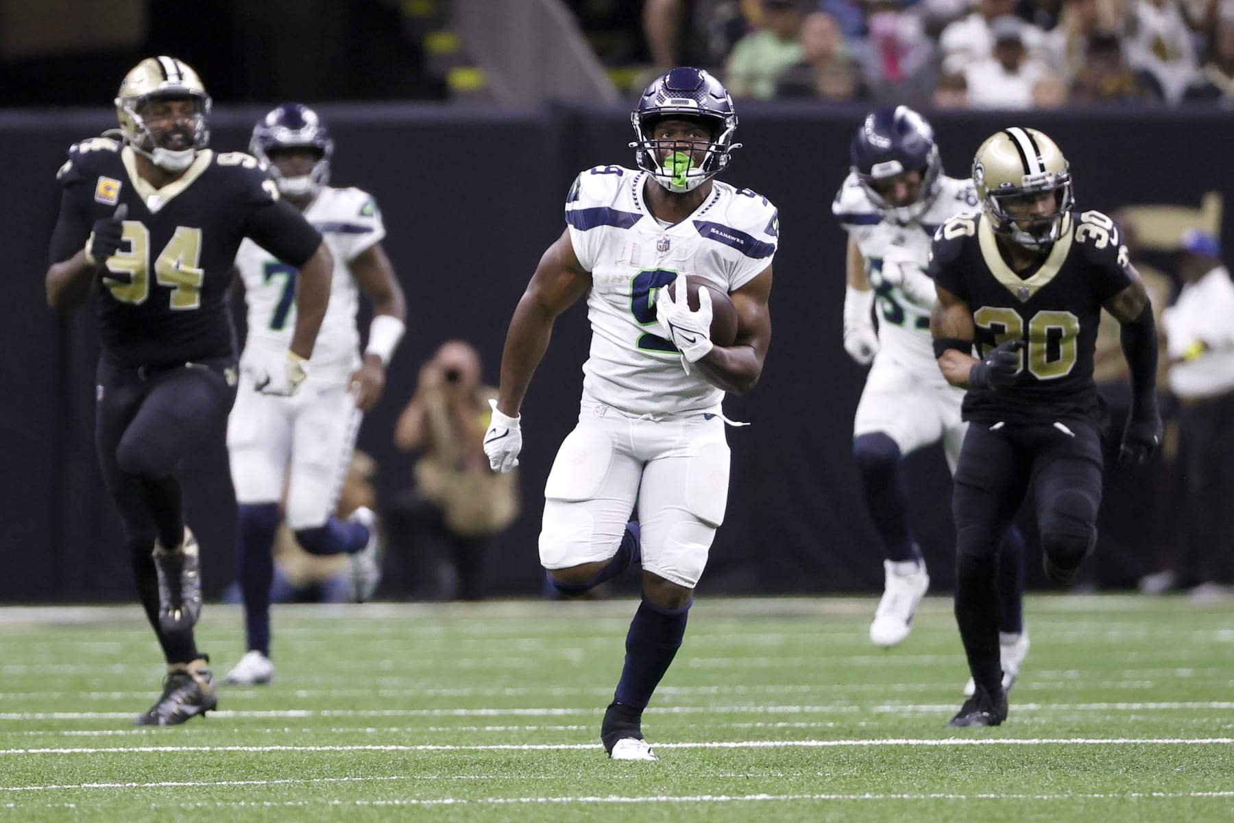 Seattle Seahawks running back Kenneth Walker III takes off on his 69 yard rushing touchdown as New Orleans Saints defensive end Cameron Jordan (94) and Pete Werner pursue during an NFL football game against the New Orleans Saints in New Orleans, Sunday, Oct. 9, 2022. (AP Photo/Derick Hingle)