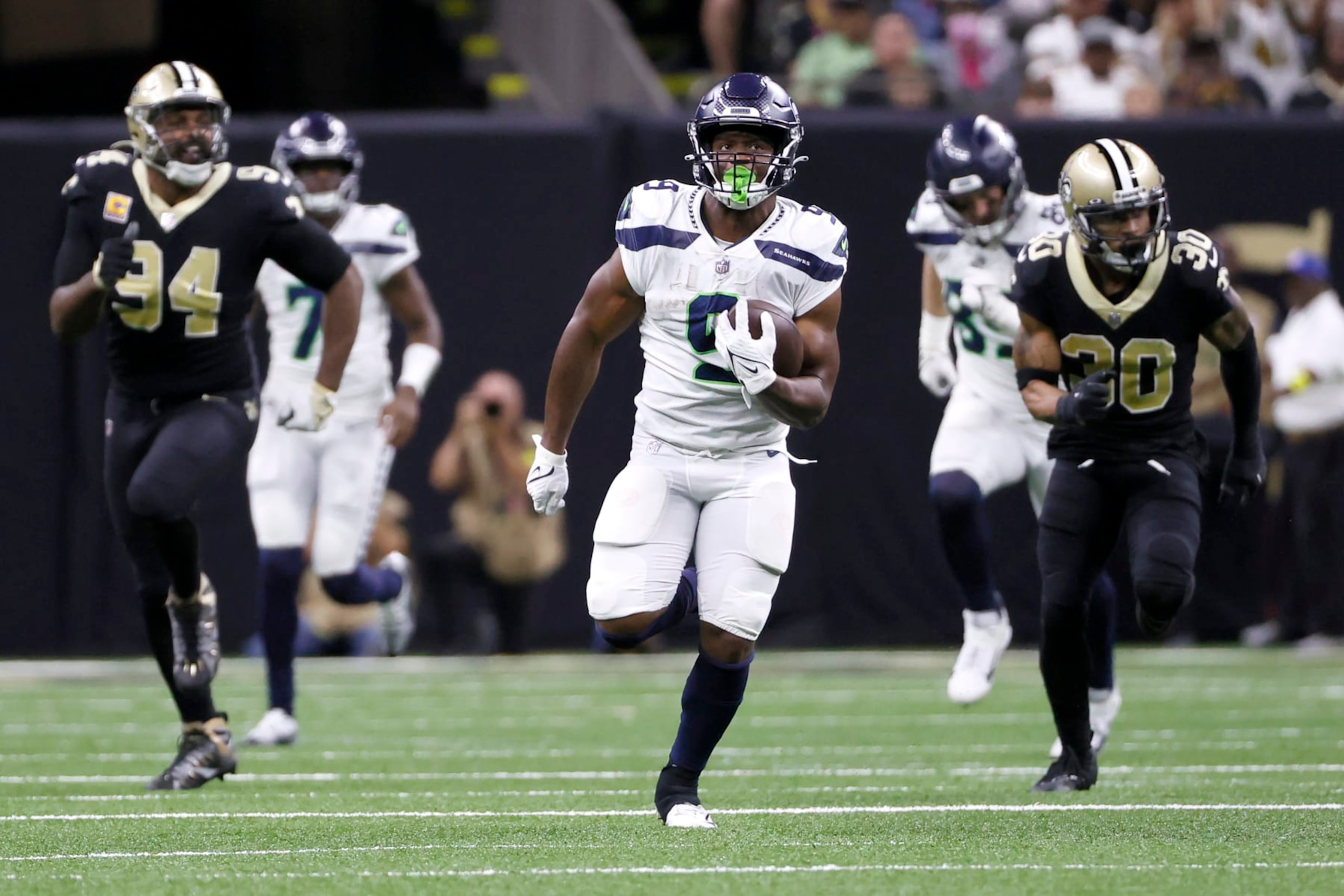 Seattle Seahawks running back Kenneth Walker III takes off on his 69 yard rushing touchdown as New Orleans Saints defensive end Cameron Jordan (94) and Pete Werner pursue during an NFL football game against the New Orleans Saints in New Orleans, Sunday, Oct. 9, 2022. (AP Photo/Derick Hingle)