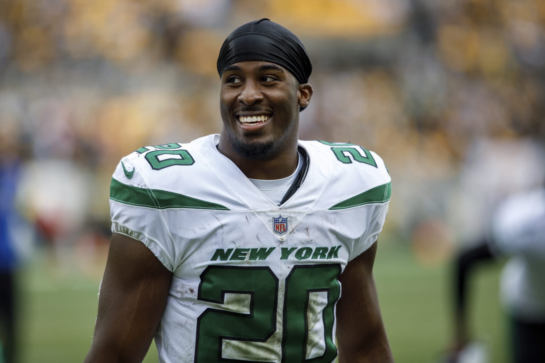 New York Jets running back Breece Hall (20) smiles while walking off the field during an NFL football game, Sunday, Oct. 2, 2022, in Pittsburgh, PA. (AP Photo/Matt Durisko)