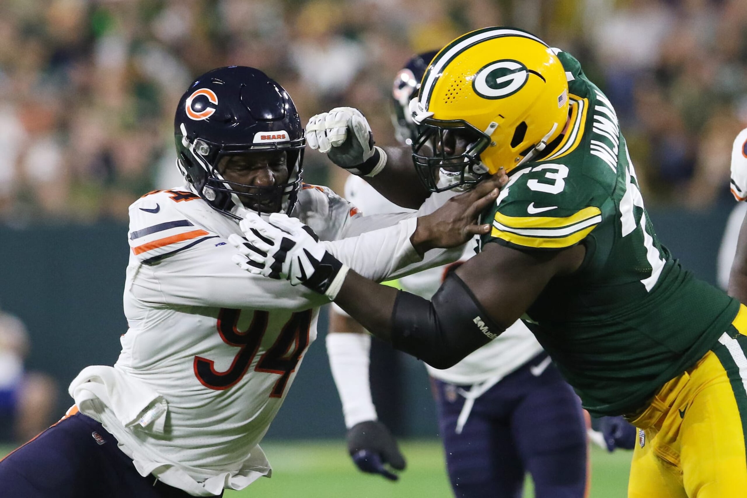 GREEN BAY, WI - SEPTEMBER 18: Chicago Bears linebacker Robert Quinn (94) tries to get by Green Bay Packers offensive tackle Yosh Nijman (73) during a game between the Green Bay Packers and the Chicago Bears on September 18, 2022 at Lambeau Field in Green Bay, WI. (Photo by Larry Radloff/Icon Sportswire via Getty Images)