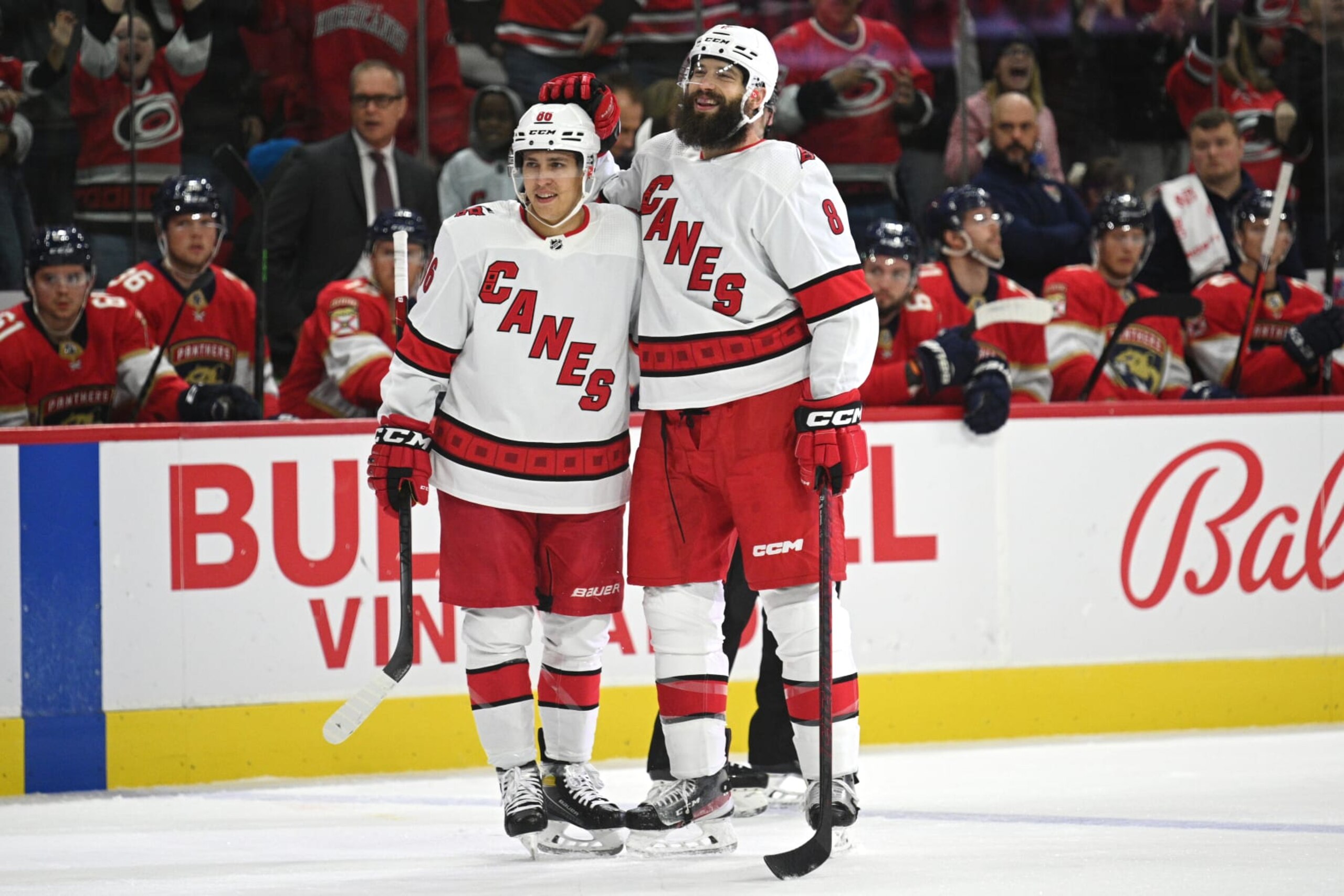 RALEIGH, NC - OCTOBER 1: Teuvo Teravainen #86 and Brent Burns #8 of the Carolina Hurricanes celebrate scoring a goal against the Florida Panthers  at PNC Arena on October1, 2022 in Raleigh, North Carolina. (Photo by Kaydee Gawlik/NHLI via Getty Images)