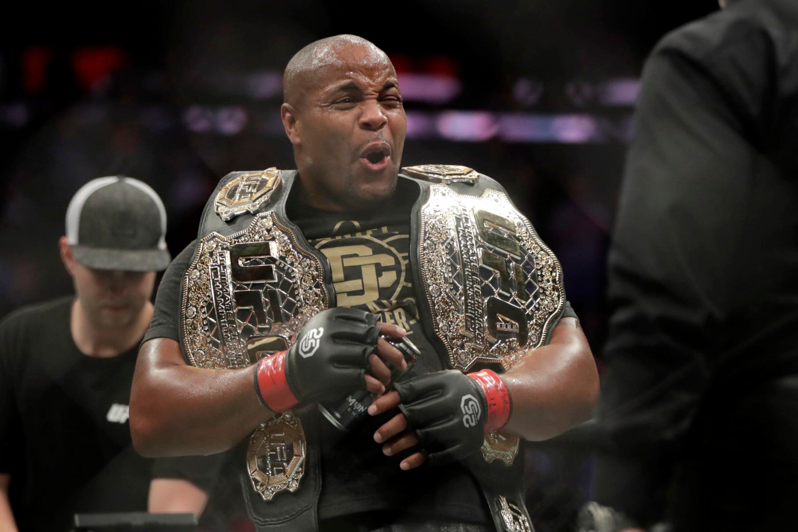 FILE - Daniel Cormier reacts after defeating Derrick Lewis by submission in the second round of a heavyweight mixed martial arts bout at UFC 230, early Sunday, Nov. 4, 2018, at Madison Square Garden in New York. Cormier insisted he retired from MMA competition. So what was the two-time UFC heavyweight champion doing again Saturday night inside a cage? Cormier was the guest referee at a WWE event and he told The Associated Press after the card he's thinking of following in the path of Ronda Rousey and Brock Lesnar and making the jump to the squared circle. (AP Photo/Julio Cortez, File)