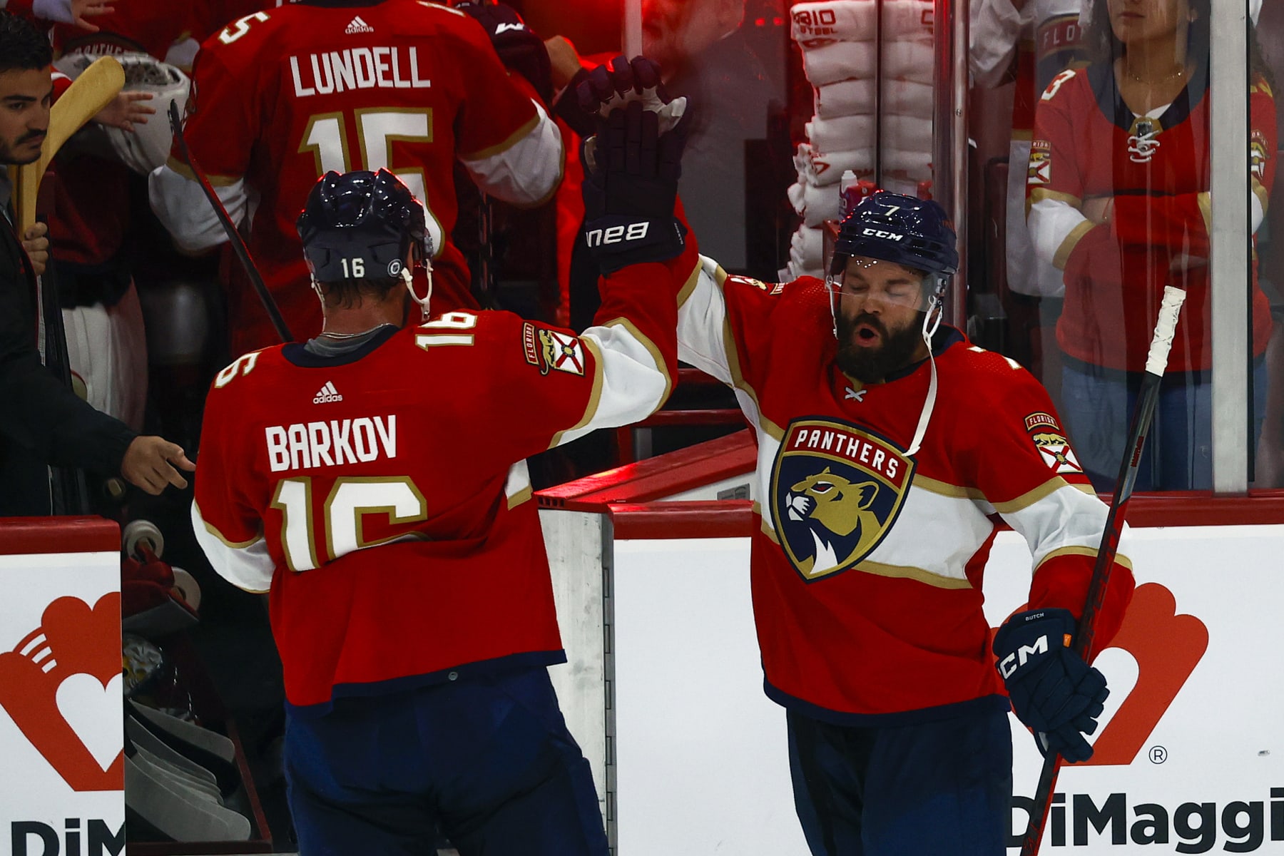 SUNRISE, FL - OCTOBER 6: Aleksander Barkov #16 and Radko Gudas #7 of the Florida Panthers celebrate the 3-2 win against the Tampa Bay Lightning in a preseason game at the FLA Live Arena on October 6, 2022 in Sunrise, Florida. (Photo by Joel Auerbach/Getty Images)