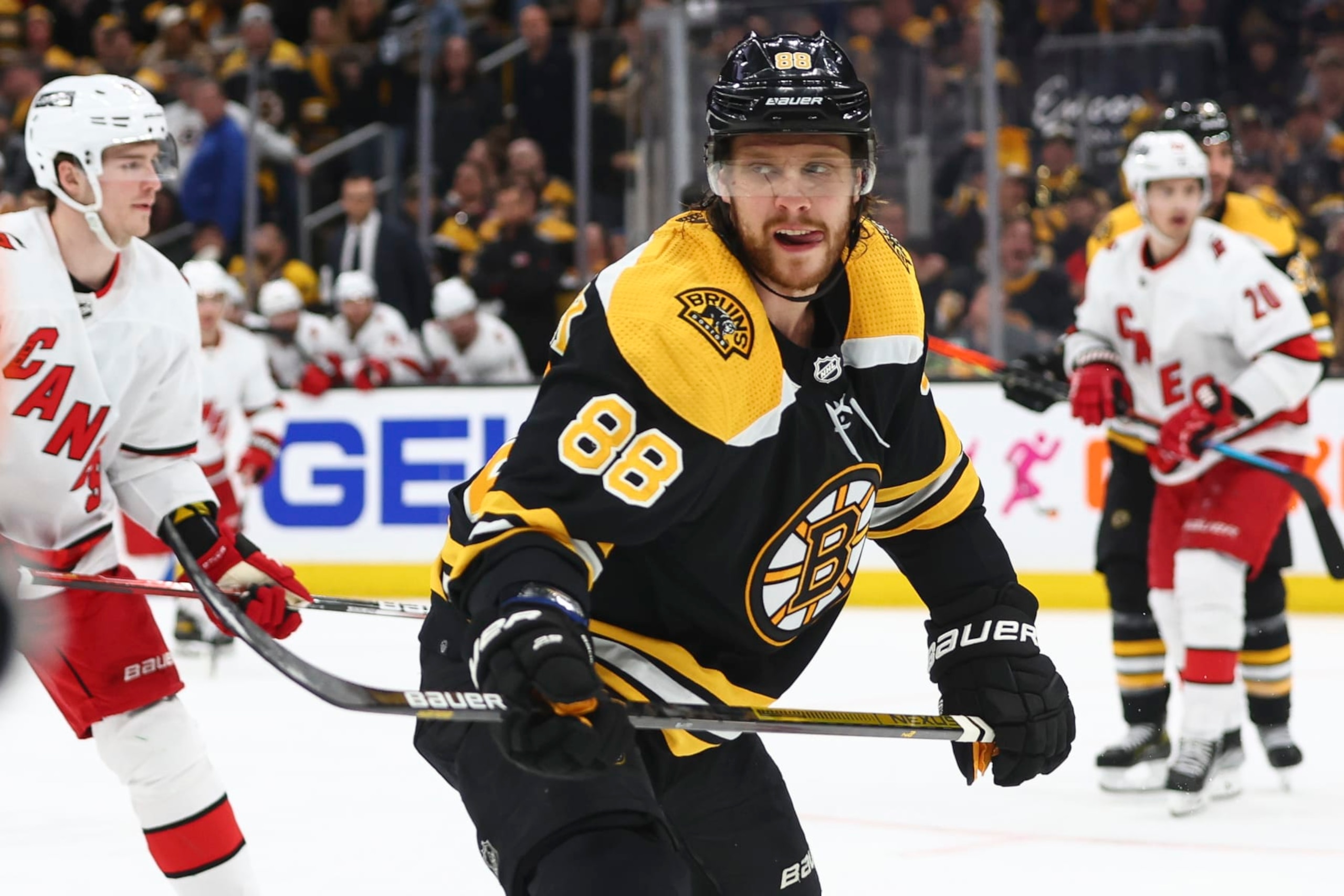 BOSTON, MA - MAY 08: David Pastrnak #88 of the Boston Bruins react safer scoring in the third period against the Carolina Hurricanes in Game Four of the First Round of the 2022 Stanley Cup Playoffs at TD Garden on May 8, 2022 in Boston, Massachusetts. (Photo by Adam Glanzman/Getty Images)