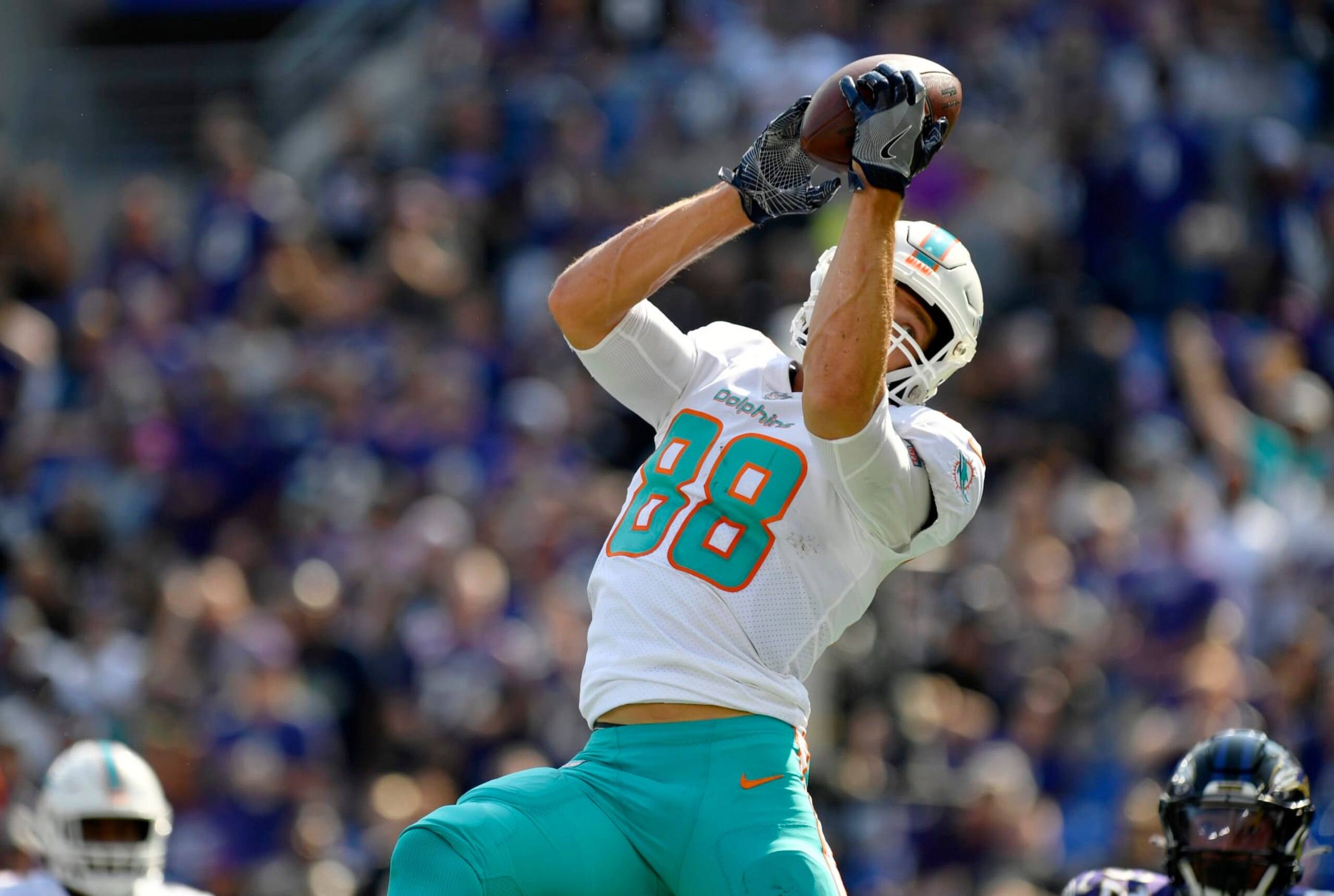 BALTIMORE, MD - SEPTEMBER 18: Miami Dolphins tight end Mike Gesicki (88) makes a leaping touchdown catch in the end zone during the Miami Dolphins versus Baltimore Ravens NFL game at M&T Bank Stadium on September 18, 2022 in Baltimore, MD (Photo by Randy Litzinger/Icon Sportswire via Getty Images)