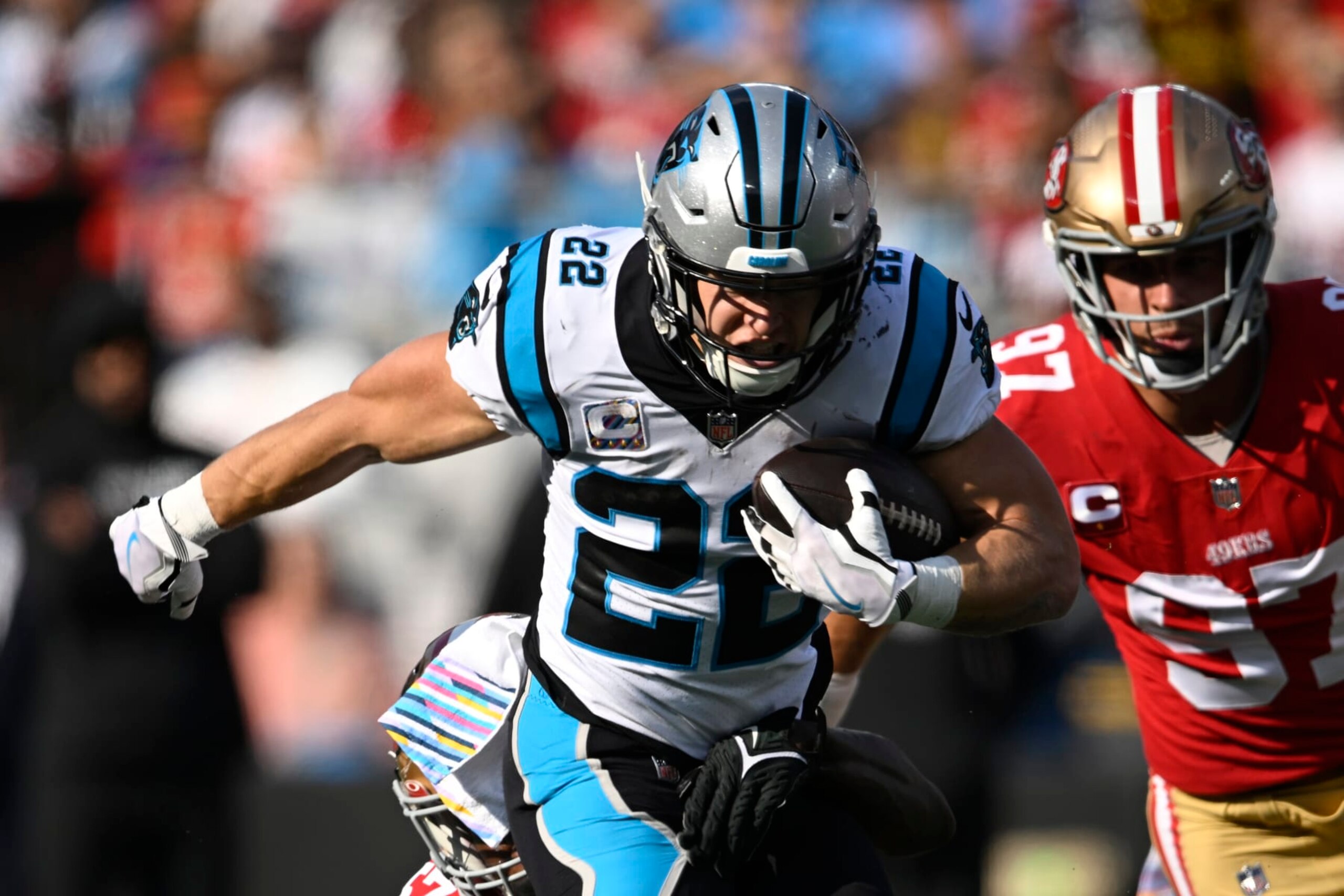 CHARLOTTE, NORTH CAROLINA - OCTOBER 09: Christian McCaffrey #22 of the Carolina Panthers runs the ball during the first half in the game against the San Francisco 49ers at Bank of America Stadium on October 09, 2022 in Charlotte, North Carolina. (Photo by Eakin Howard/Getty Images)