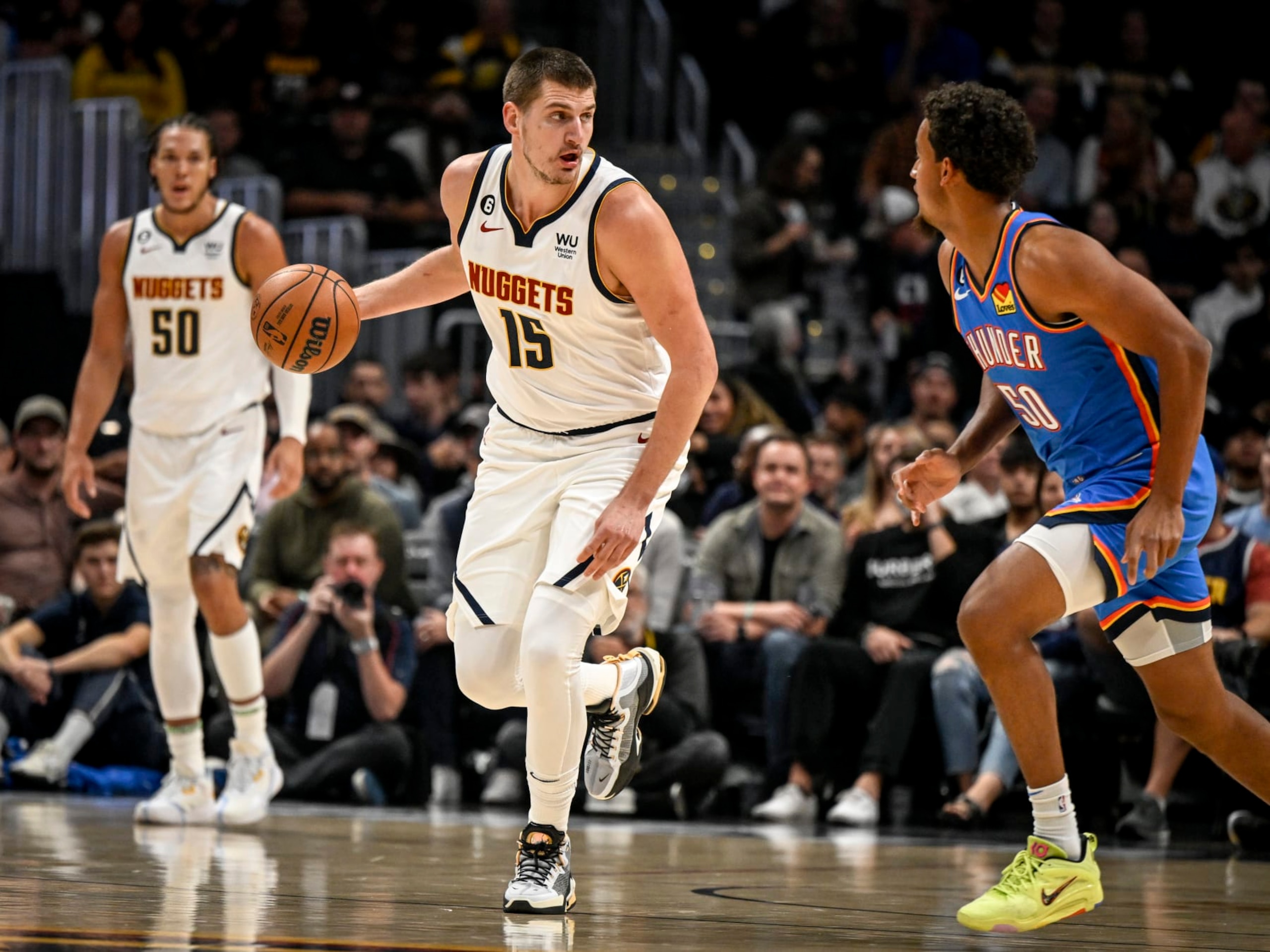 DENVER, CO - OCTOBER 3: Nikola Jokic (15) of the Denver Nuggets handles the ball in transition as Jeremiah Robinson-Earl (50) of the Oklahoma City Thunder defends during the first quarter on Monday, October 3, 2022. (Photo by AAron Ontiveroz/MediaNews Group/The Denver Post via Getty Images) DENVER, CO - OCTOBER 3: Nikola Jokic (15) of the Denver Nuggets handles the ball in transition as Jeremiah Robinson-Earl (50) of the Oklahoma City Thunder defends during the first quarter on Monday, October 3, 2022. (Photo by AAron Ontiveroz/MediaNews Group/The Denver Post via Getty Images)