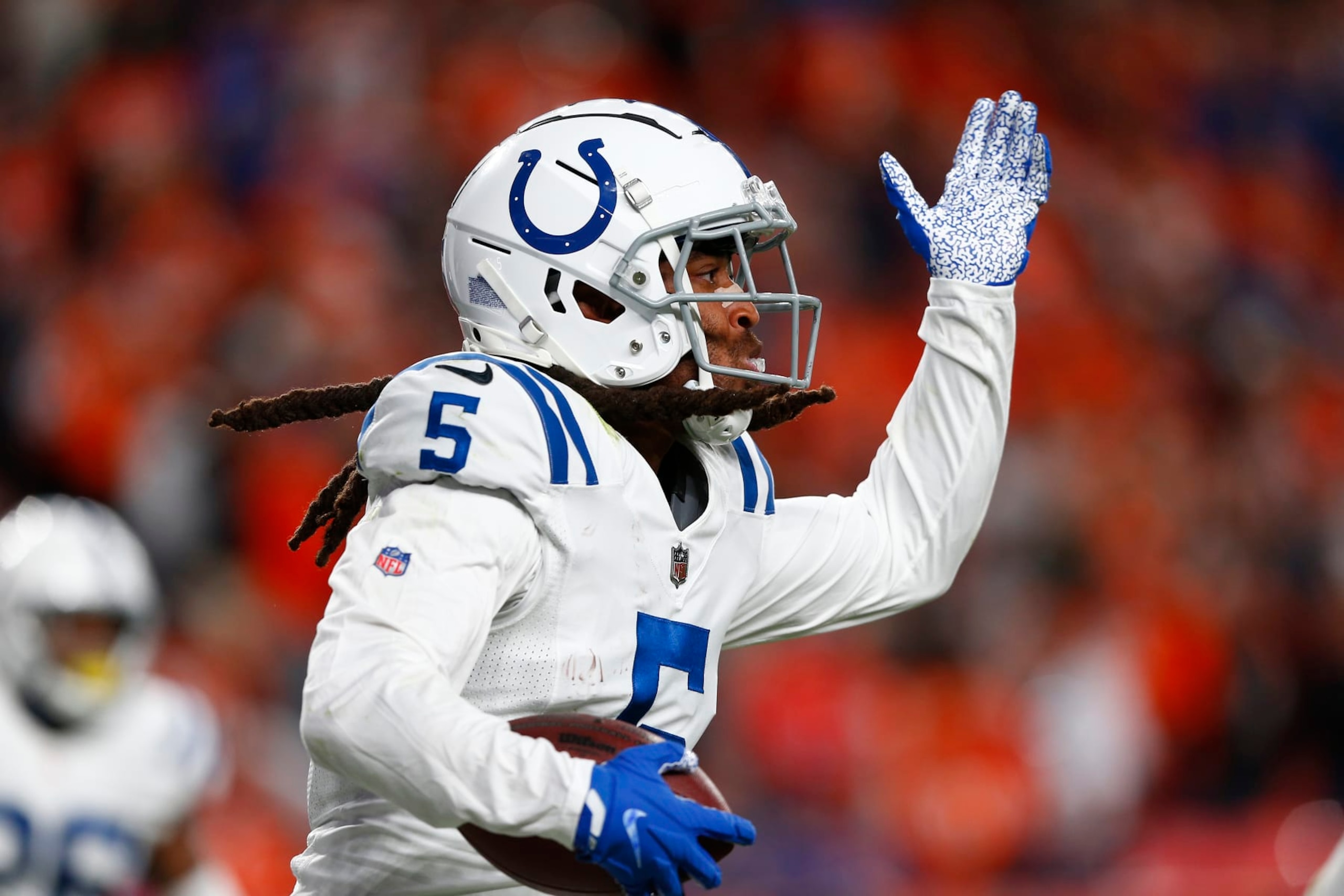 DENVER, CO - OCTOBER 06: Indianapolis Colts Cornerback Stephon Gilmore (5) celebrates his interception in the end zone late in the fourth quarter of play during and NFL game between the Indianapolis Colts and the Denver Broncos on October 06, 2022 at Empower Field at Mile High in Denver CO. (Photo by Jeffrey Brown/Icon Sportswire via Getty Images)