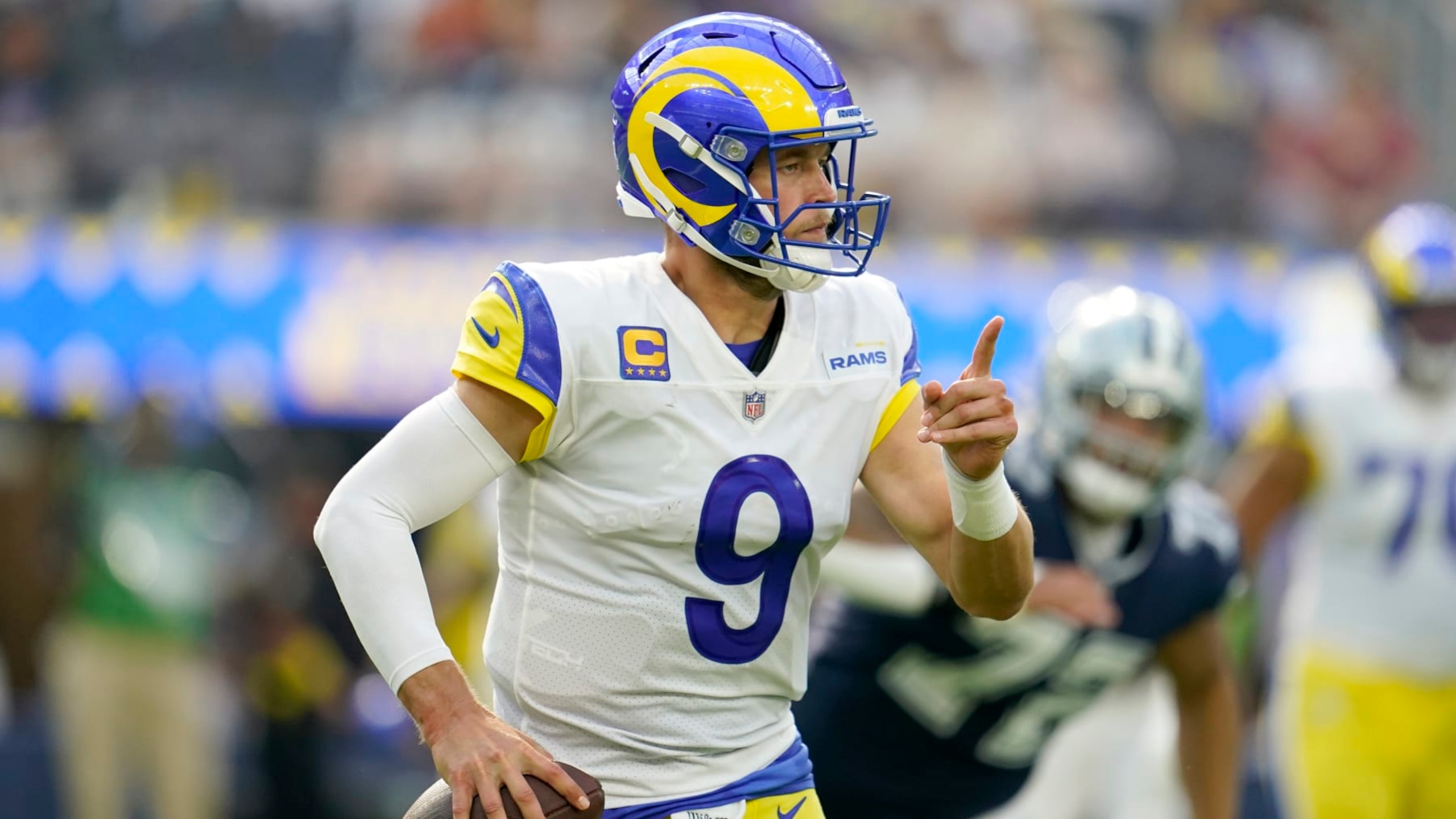 Los Angeles Rams quarterback Matthew Stafford scrambles out of the pocket for a gain during a an NFL football game against the Dallas Cowboys, Sunday, Oct. 9, 2022, in Inglewood, Calif. (AP Photo/Marcio Jose Sanchez)