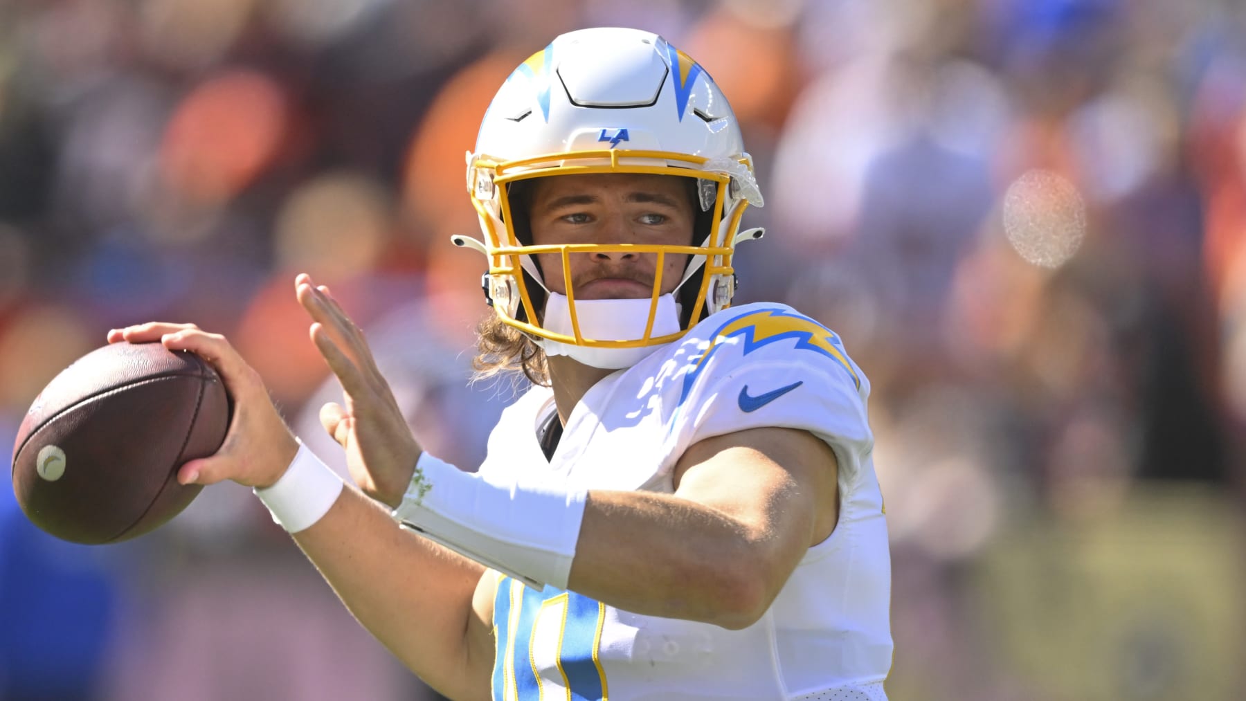 Los Angeles Chargers quarterback Justin Herbert (10) passes against the Cleveland Browns during the first half of an NFL football game, Sunday, Oct. 9, 2022, in Cleveland. (AP Photo/David Richard)