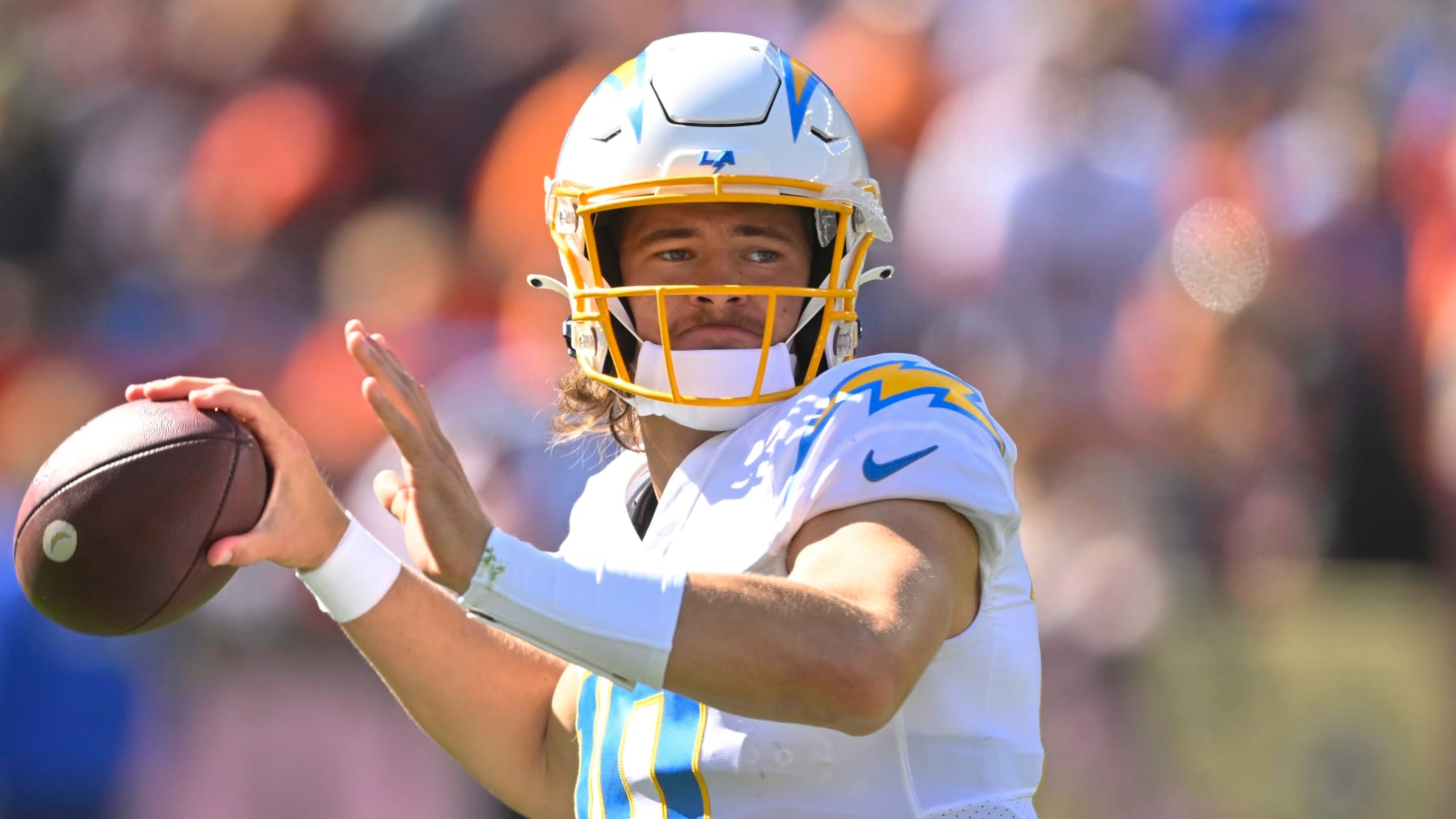 Los Angeles Chargers quarterback Justin Herbert (10) passes against the Cleveland Browns during the first half of an NFL football game, Sunday, Oct. 9, 2022, in Cleveland. (AP Photo/David Richard)