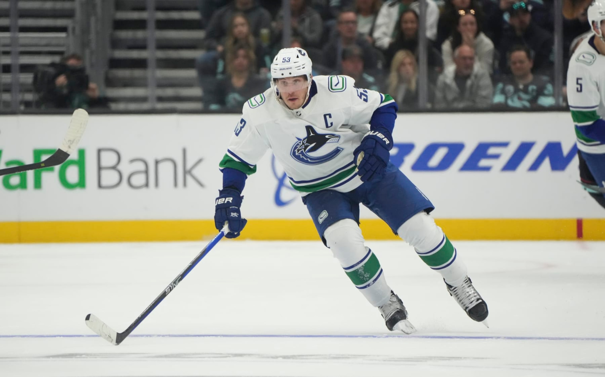 SEATTLE, WA - OCTOBER 01: Vancouver Canucks center Bo Horvat (53) looks down the ice during an NHL pre-season game between the Vancouver Canucks and the Seattle Kraken on October 1, 2022 at Climate Pledge Arena in Seattle, WA.  (Photo by Jeff Halstead/Icon Sportswire via Getty Images)