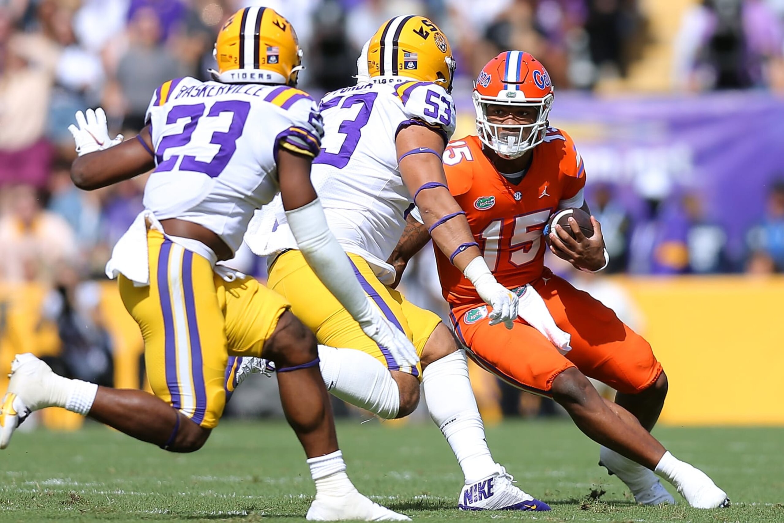 BATON ROUGE, LOUISIANA - OCTOBER 16: Anthony Richardson #15 of the Florida Gators runs with the ball as Soni Fonua #53 and Micah Baskerville #23 of the LSU Tigers defend during the first half at Tiger Stadium on October 16, 2021 in Baton Rouge, Louisiana. (Photo by Jonathan Bachman/Getty Images)