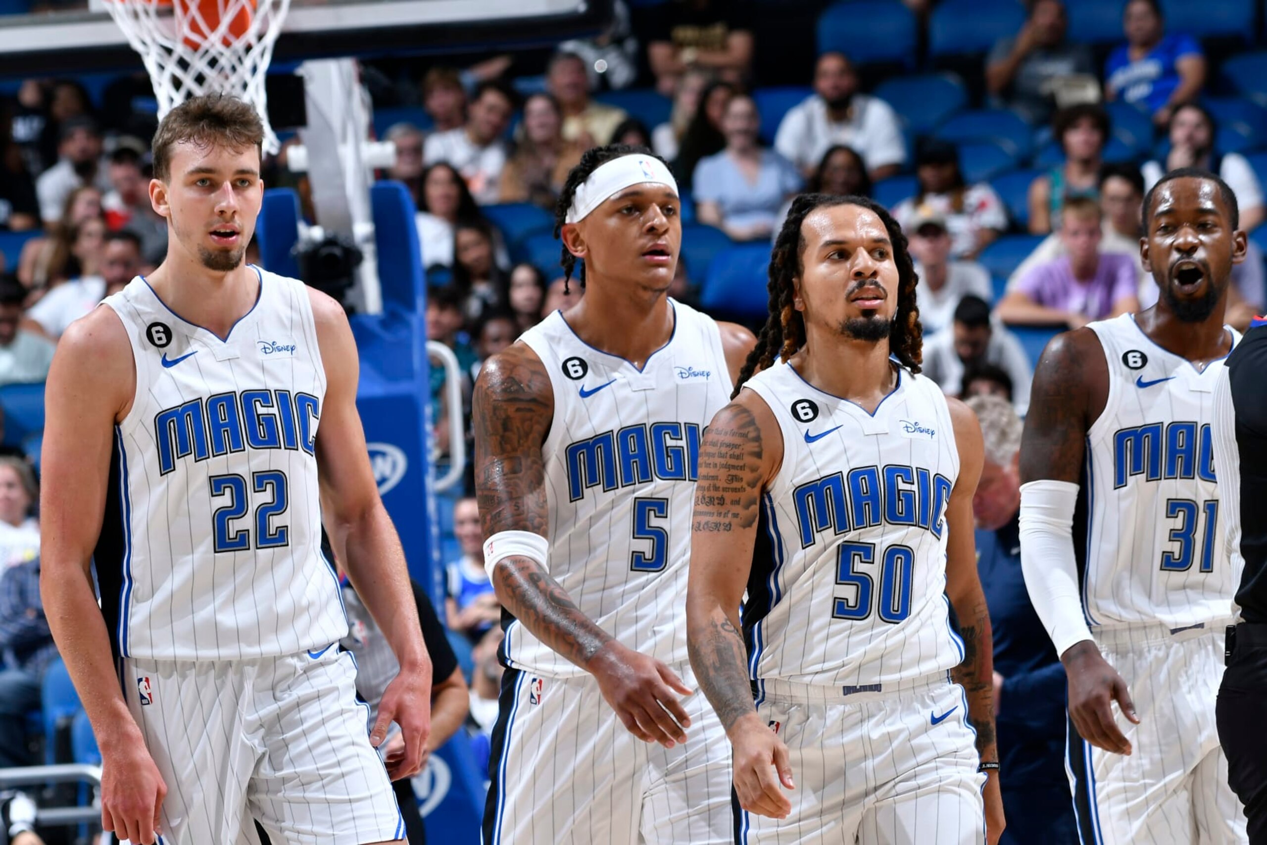 ORLANDO, FL - OCTOBER 11: Franz Wagner #22, Paolo Banchero #5, Cole Anthony #50 and Terrence Ross #31 of the Orlando Magic look on during the game against the Memphis Grizzlies on October 11, 2022 at Amway Center in Orlando, Florida. NOTE TO USER: User expressly acknowledges and agrees that, by downloading and or using this photograph, User is consenting to the terms and conditions of the Getty Images License Agreement. Mandatory Copyright Notice: Copyright 2022 NBAE (Photo by Fernando Medina/NBAE via Getty Images)
