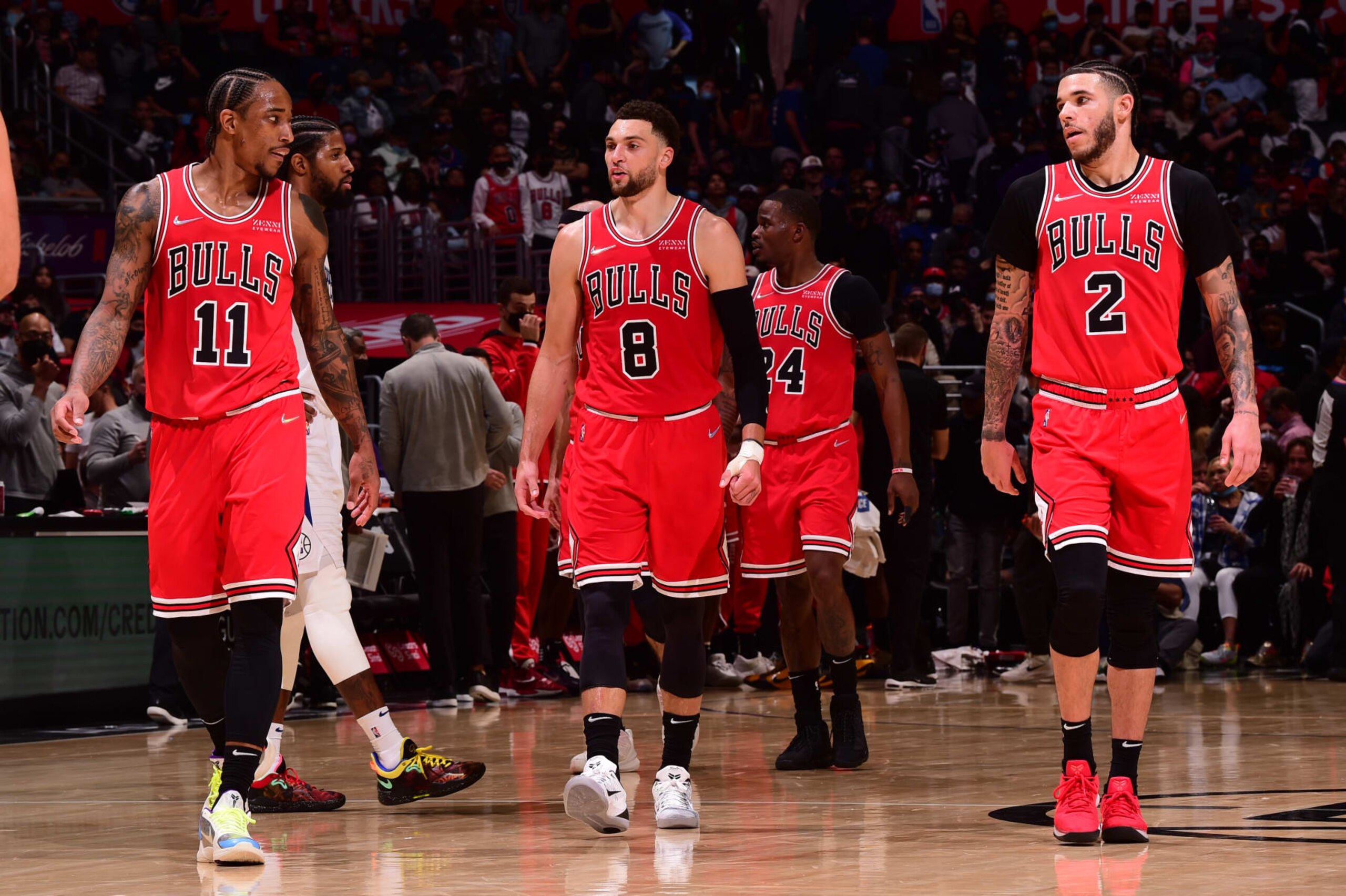 LOS ANGELES, CA - NOVEMBER 14: DeMar DeRozan #11, Zach LaVine #8, and Lonzo Ball #2 of the Chicago Bulls looks on during the game against the LA Clippers on November 14, 2021 at STAPLES Center in Los Angeles, California. NOTE TO USER: User expressly acknowledges and agrees that, by downloading and/or using this Photograph, user is consenting to the terms and conditions of the Getty Images License Agreement. Mandatory Copyright Notice: Copyright 2021 NBAE (Photo by Noah Graham/NBAE via Getty Images)