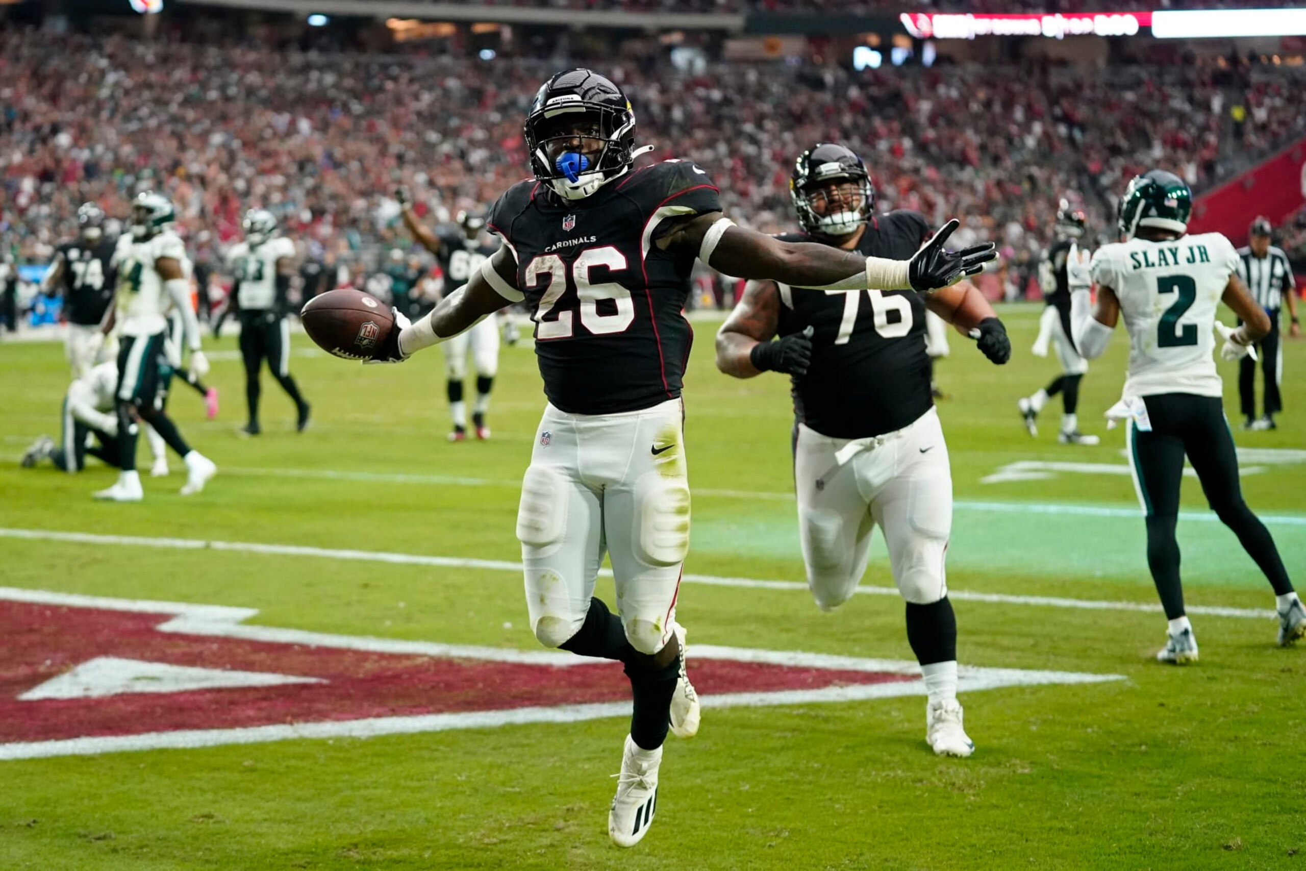 Arizona Cardinals running back Eno Benjamin (26) celebrates after scoring a touchdown against the Philadelphia Eagles during the second half an NFL football game, Sunday, Oct. 9, 2022, in Glendale, Ariz. (AP Photo/Ross D. Franklin)