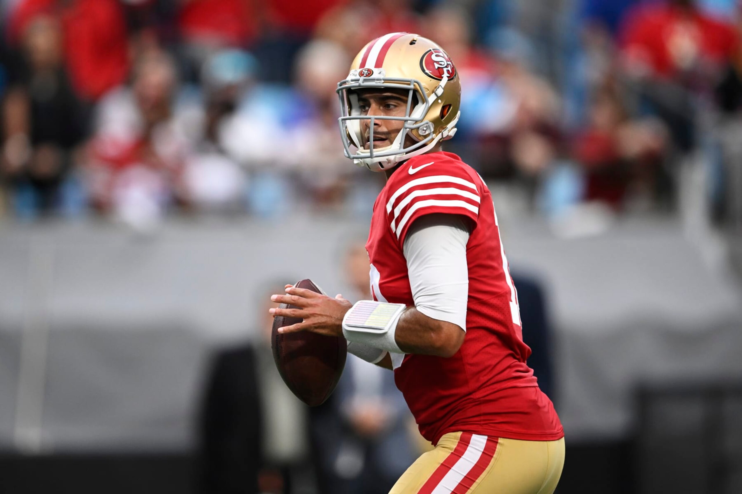 CHARLOTTE, NORTH CAROLINA - OCTOBER 09: Jimmy Garoppolo #10 of the San Francisco 49ers looks for a pass against the Carolina Panthers in the third quarter at Bank of America Stadium on October 09, 2022 in Charlotte, North Carolina. (Photo by Eakin Howard/Getty Images)