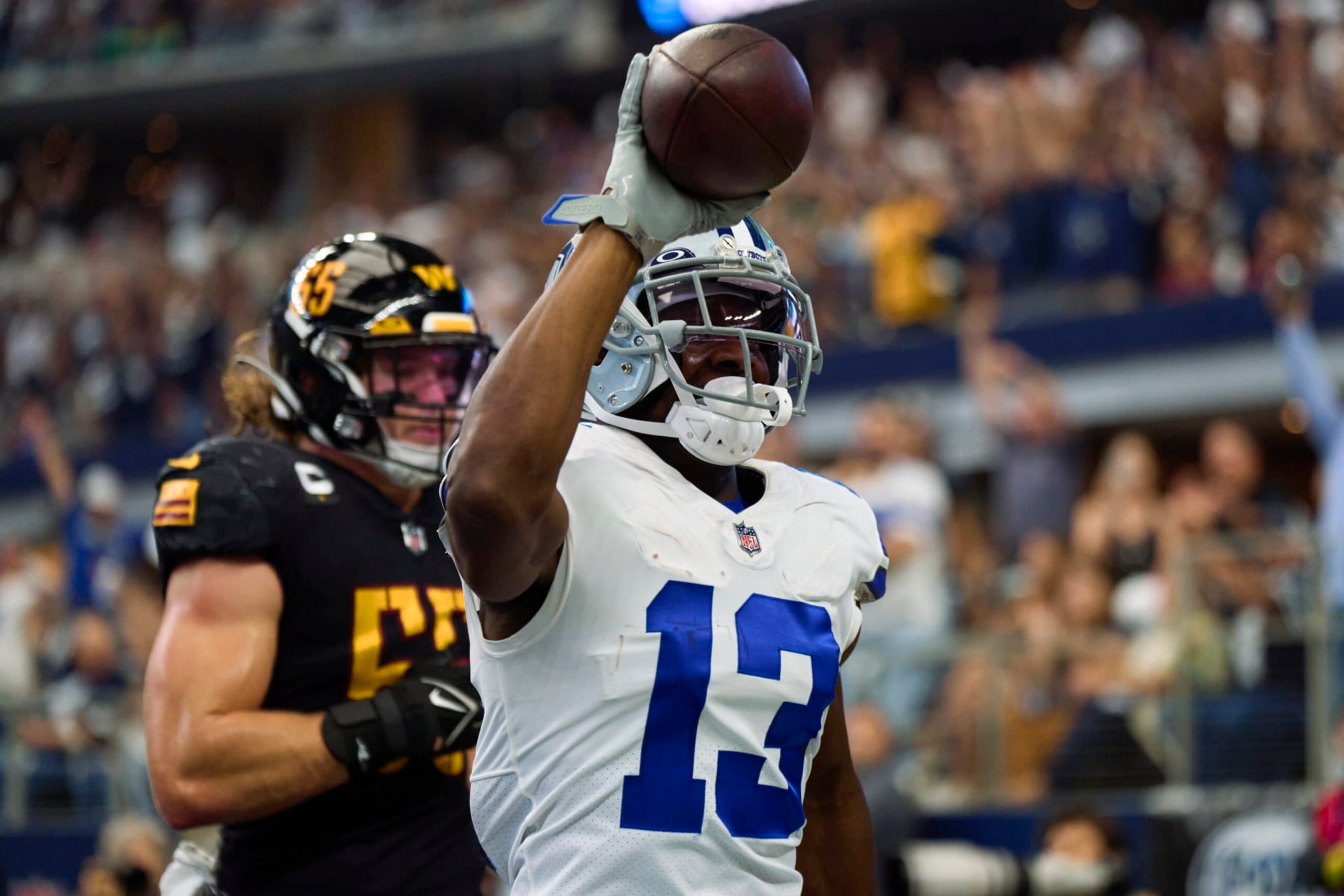 ARLINGTON, TX - OCTOBER 02: Michael Gallup #13 of the Dallas Cowboys catches a touchdown pass against the Washington Commanders at AT&T Stadium on October 2, 2022 in Arlington, Texas. (Photo by Cooper Neill/Getty Images)