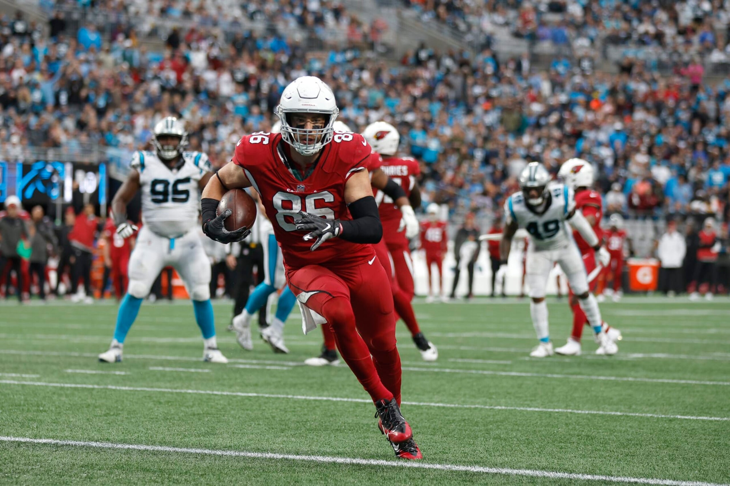 CHARLOTTE, NORTH CAROLINA - OCTOBER 02: Zach Ertz #86 of the Arizona Cardinals runs for a touchdown during the third quarter against the Carolina Panthers at Bank of America Stadium on October 02, 2022 in Charlotte, North Carolina. (Photo by Jared C. Tilton/Getty Images)