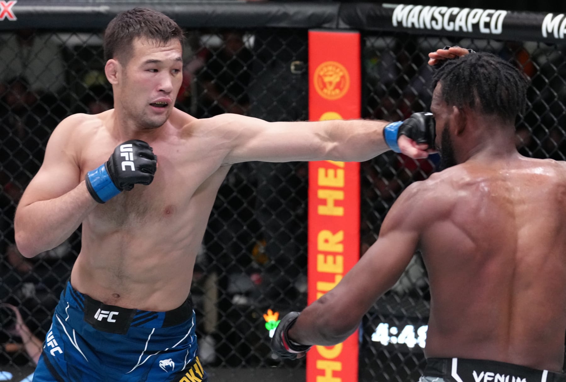 LAS VEGAS, NEVADA - JUNE 25: (L-R) Shavkat Rakhmonov of Uzbekistan punches Neil Magny in a welterweight fight during the UFC Fight Night event at UFC APEX on June 25, 2022 in Las Vegas, Nevada. (Photo by Jeff Bottari/Zuffa LLC)