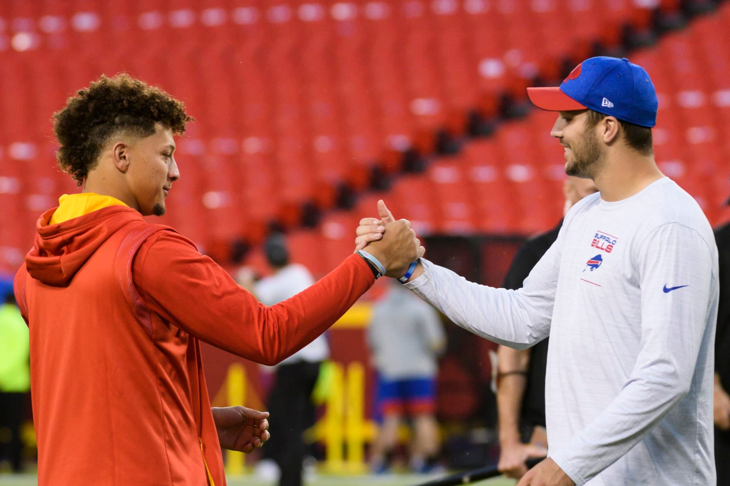 Kansas City Chiefs quarterback Patrick Mahomes, left, greets Buffalo Bills quarterback Josh Allen during pre-game warmups before an NFL football game, Sunday, Oct. 10, 2021 in Kansas City, Mo. (AP Photo/Reed Hoffmann)