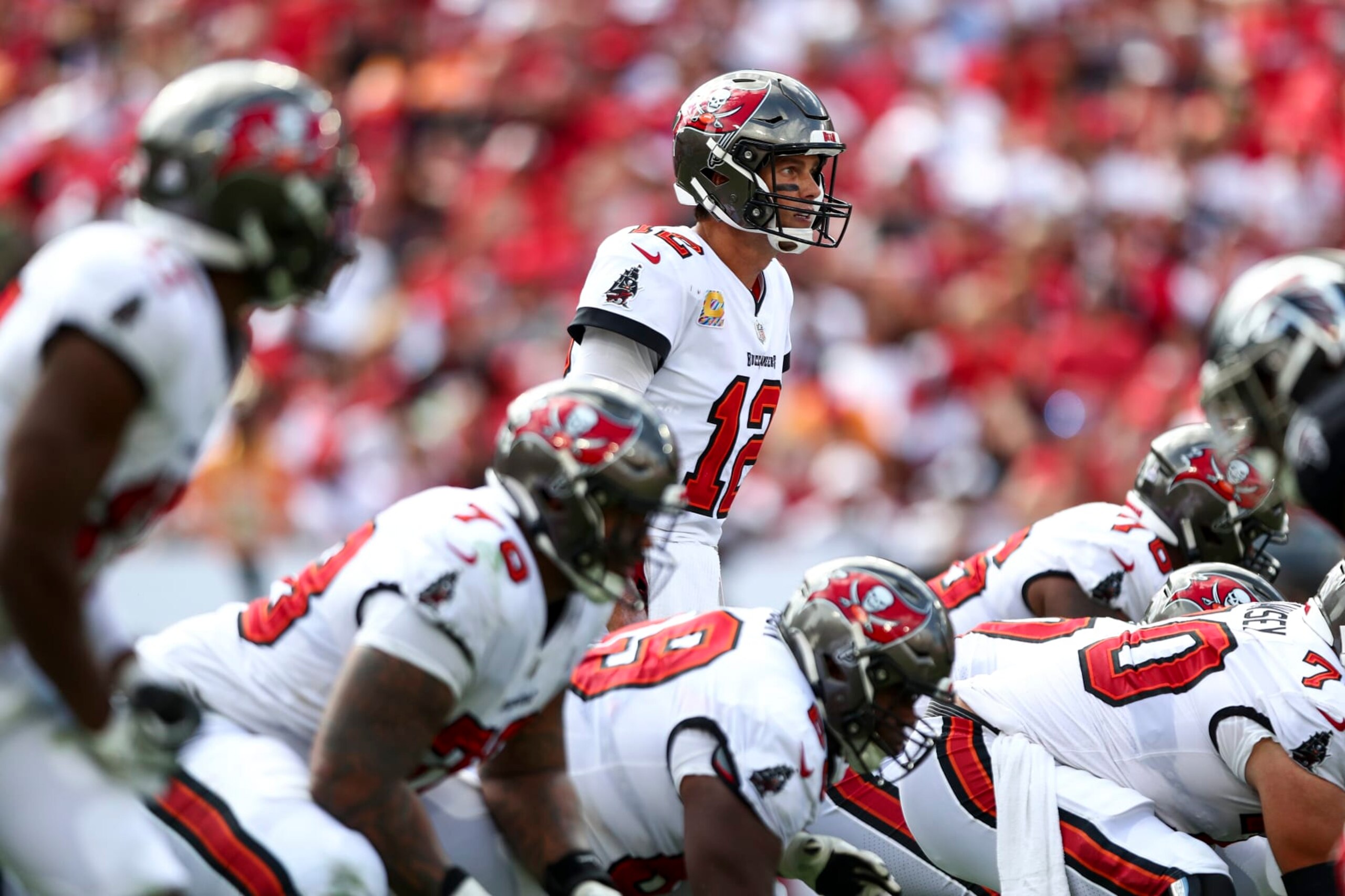 TAMPA, FL - OCTOBER 9: Tom Brady #12 of the Tampa Bay Buccaneers lines up over center before a play during an NFL football game against the Atlanta Falcons at Raymond James Stadium on October 9, 2022 in Tampa, Florida. (Photo by Kevin Sabitus/Getty Images)
