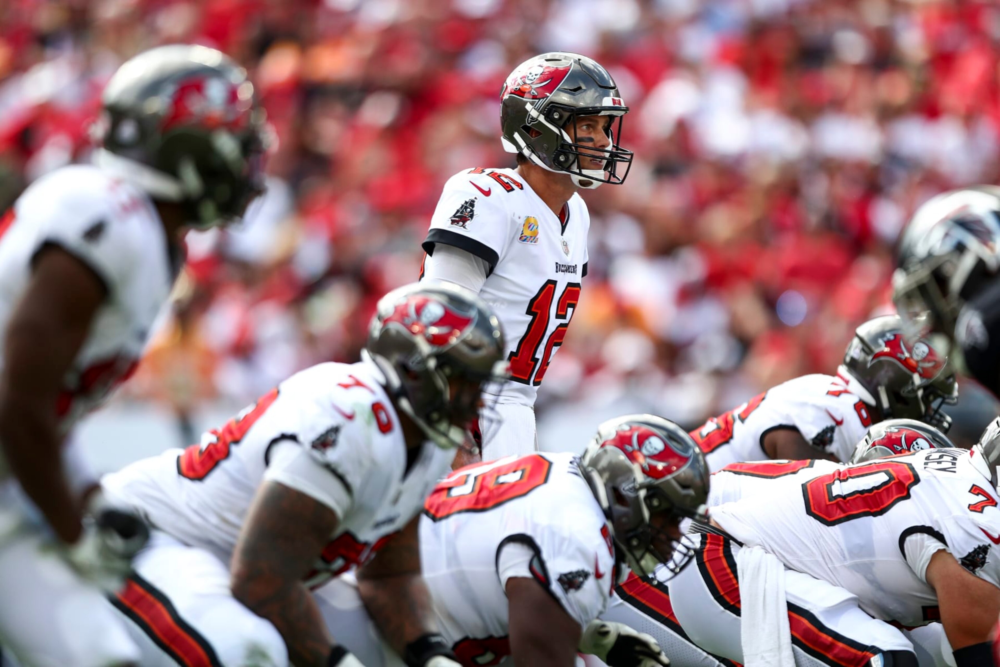 TAMPA, FL - OCTOBER 9: Tom Brady #12 of the Tampa Bay Buccaneers lines up over center before a play during an NFL football game against the Atlanta Falcons at Raymond James Stadium on October 9, 2022 in Tampa, Florida. (Photo by Kevin Sabitus/Getty Images)