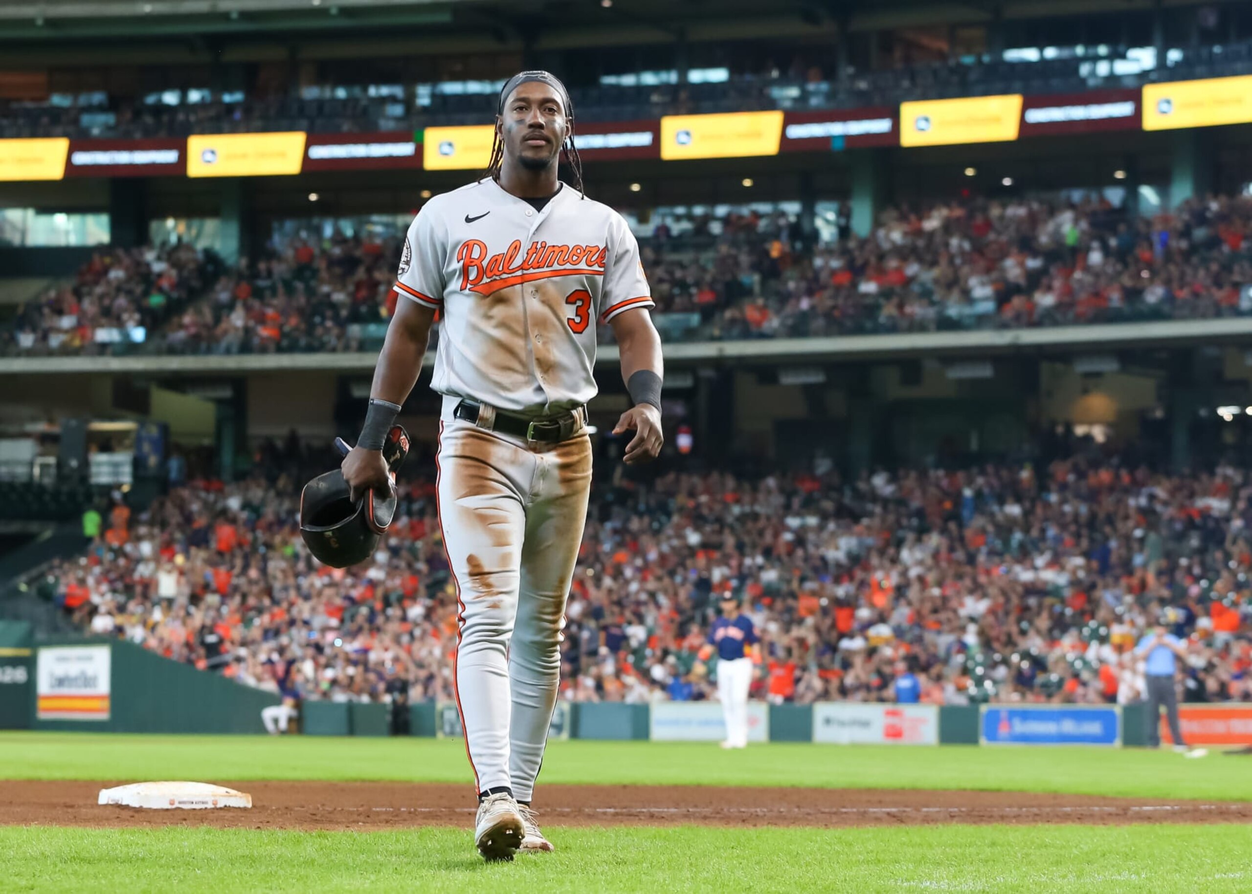 HOUSTON, TX - AUGUST 28:  Baltimore Orioles shortstop Jorge Mateo (3) returns to the dugout after getting tagged at third base in the top of the fifth inning during the MLB game between the Baltimore Orioles and Houston Astros on August 28, 2022 at Minute Maid Park in Houston, Texas.  (Photo by Leslie Plaza Johnson/Icon Sportswire via Getty Images)