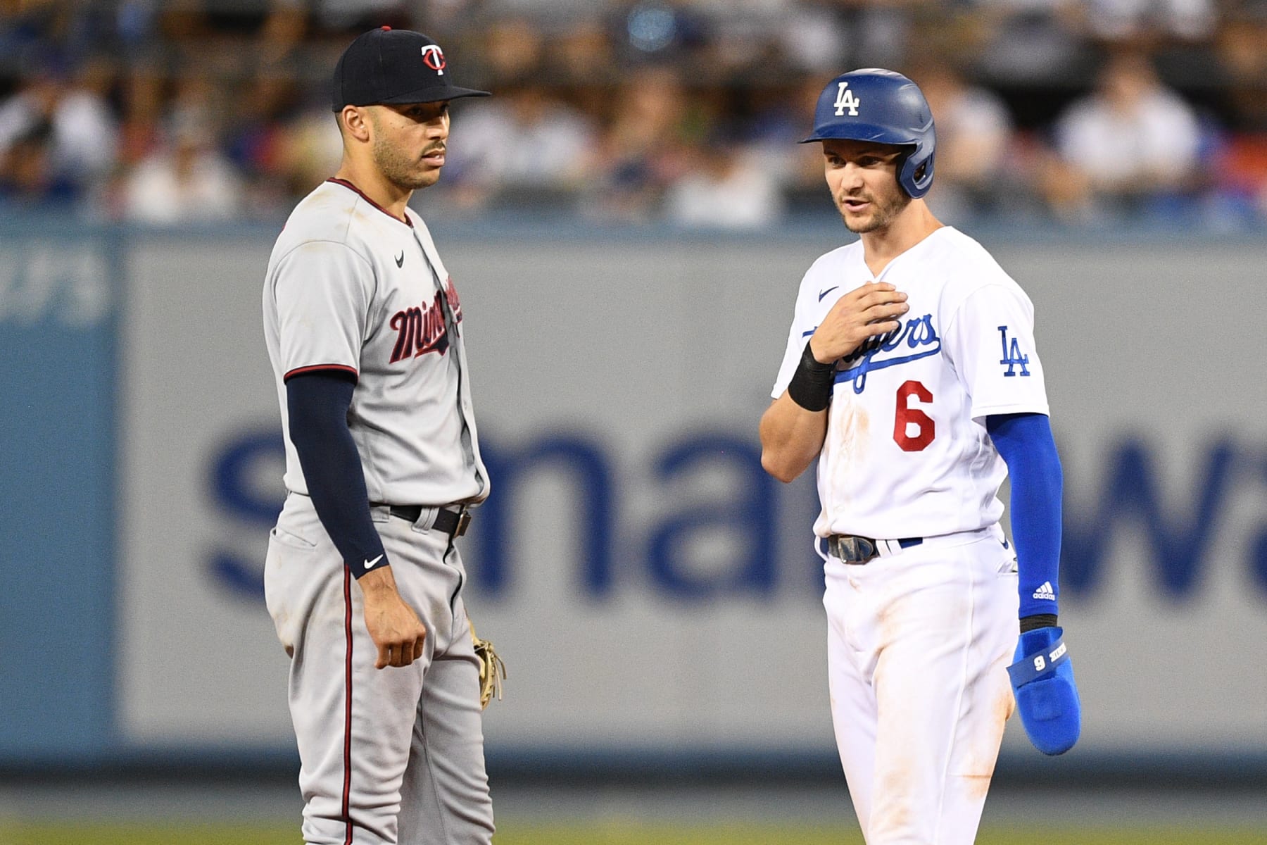 LOS ANGELES, CA - AUGUST 10: Minnesota Twins shortstop Carlos Correa (4) looks on with Los Angeles Dodgers shortstop Trea Turner (6) during the MLB game between the Minnesota Twins and the Los Angeles Dodgers on August 10, 2022 at Dodger Stadium in Los Angeles, CA. (Photo by Brian Rothmuller/Icon Sportswire via Getty Images)