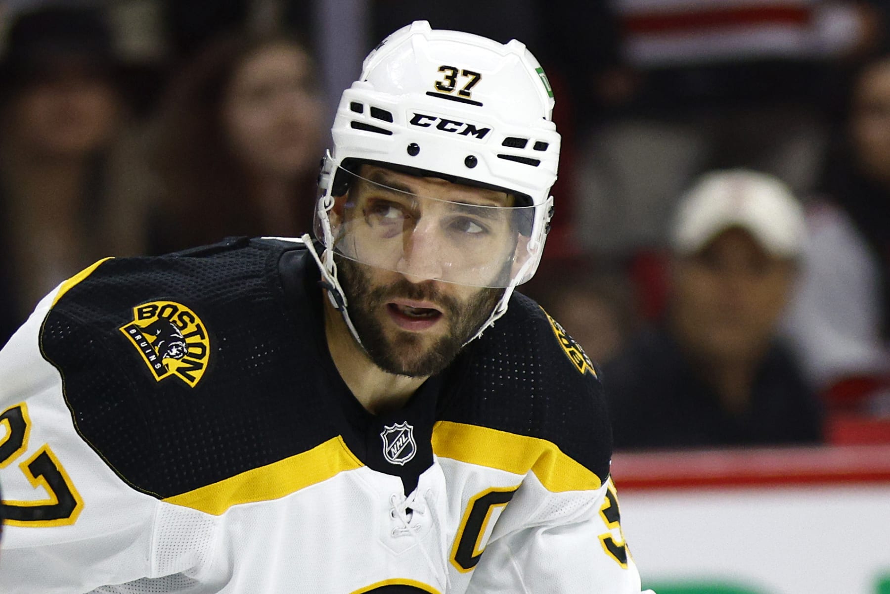 RALEIGH, NORTH CAROLINA - MAY 14: Patrice Bergeron #37 of the Boston Bruins looks on in Game Seven of the First Round of the 2022 Stanley Cup Playoffs against the Carolina Hurricanes at PNC Arena on May 14, 2022 in Raleigh, North Carolina. (Photo by Jared C. Tilton/Getty Images)