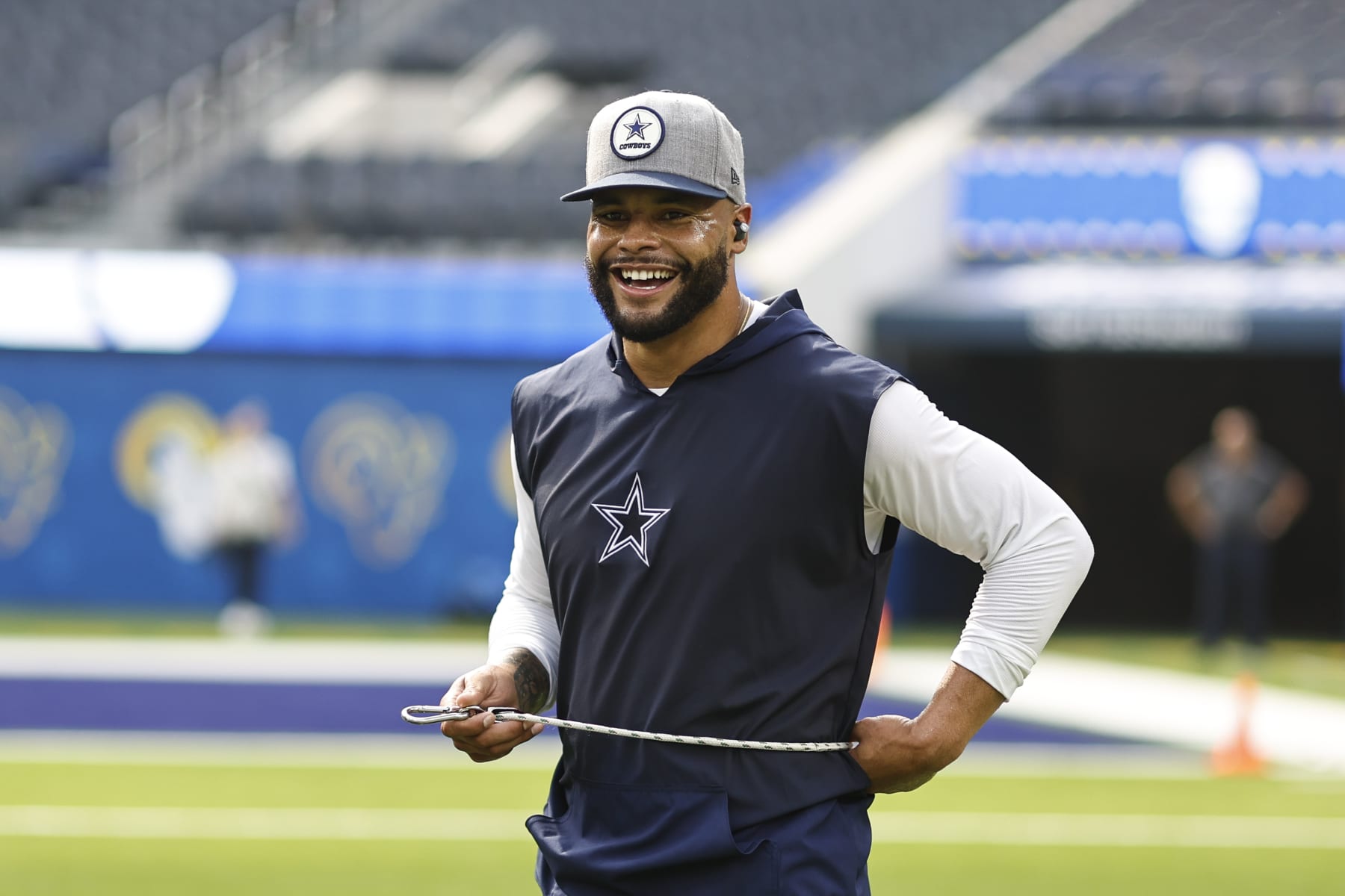 INGLEWOOD, CALIFORNIA - OCTOBER 09: Dak Prescott #4 of the Dallas Cowboys reacts as he warms up prior to a game against the Los Angeles Rams at SoFi Stadium on October 09, 2022 in Inglewood, California. (Photo by Michael Owens/Getty Images)