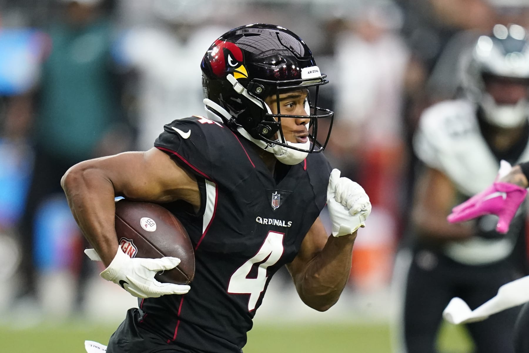 Arizona Cardinals wide receiver Rondale Moore runs with the football after making a catch against the Philadelphia Eagles during the second half of an NFL football game in Glendale, Ariz., Sunday, Oct. 9, 2022. The Eagles won 20-17. (AP Photo/Ross D. Franklin)