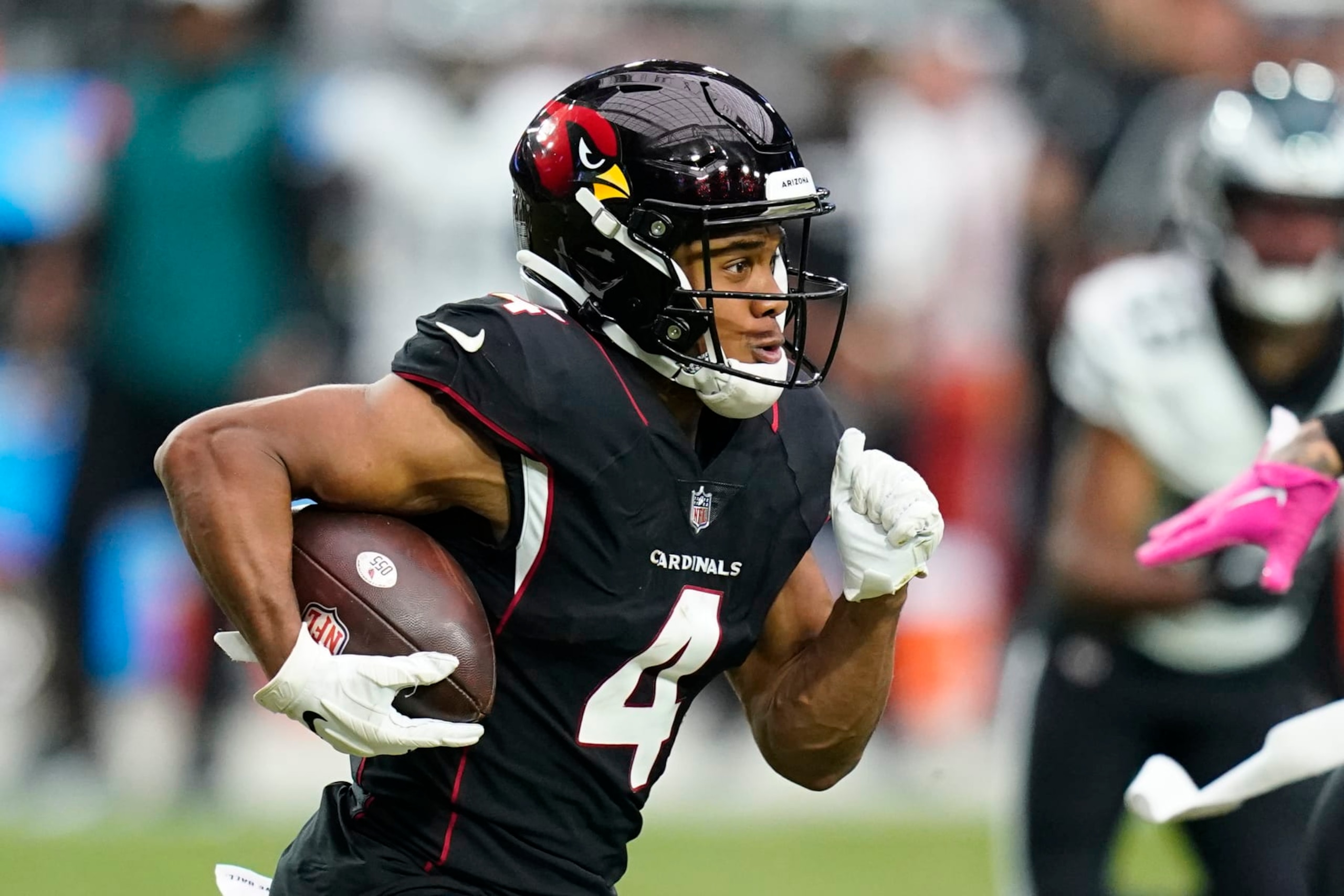 Arizona Cardinals wide receiver Rondale Moore runs with the football after making a catch against the Philadelphia Eagles during the second half of an NFL football game in Glendale, Ariz., Sunday, Oct. 9, 2022. The Eagles won 20-17. (AP Photo/Ross D. Franklin)