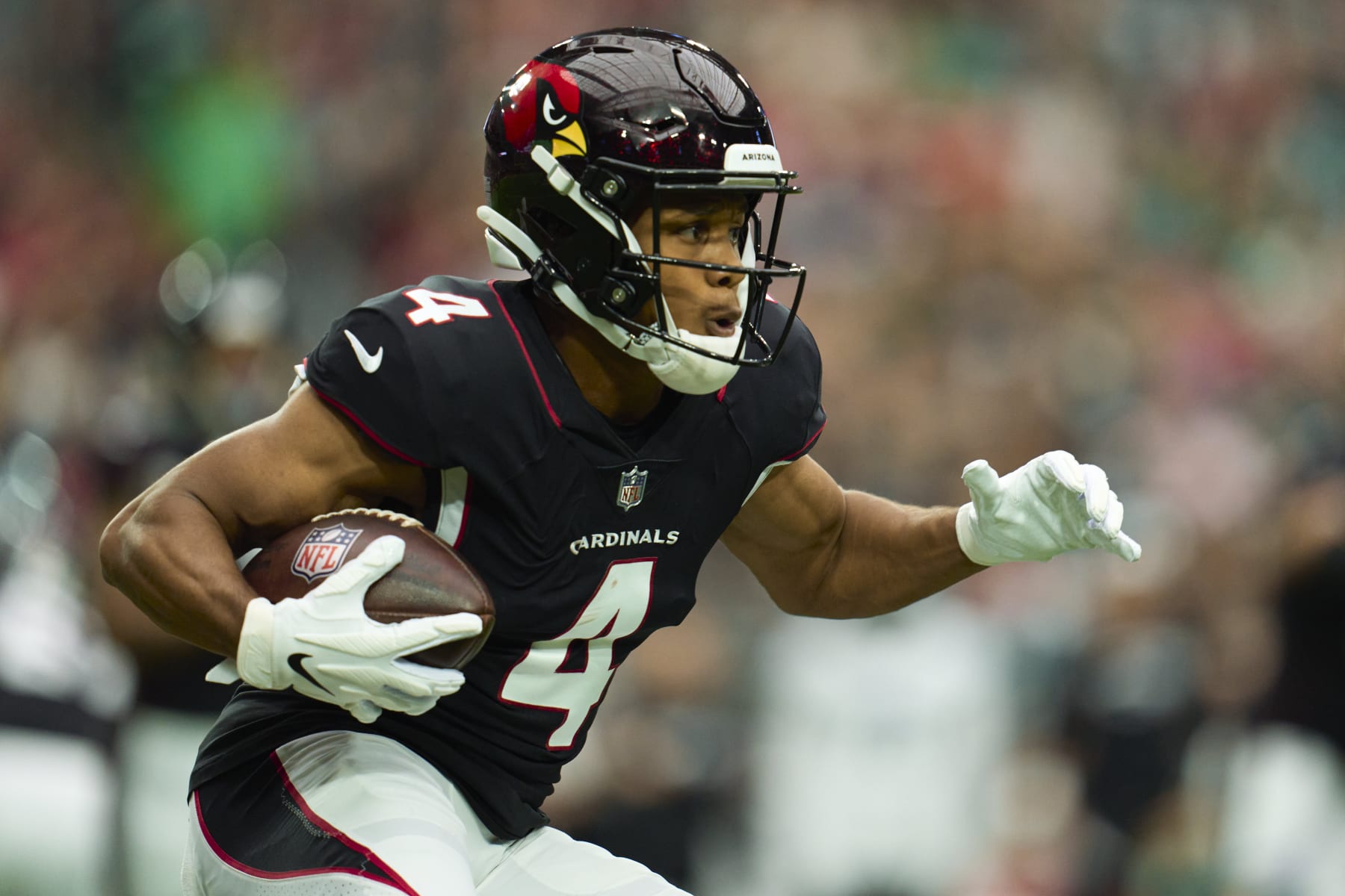 GLENDALE, AZ - OCTOBER 09: Rondale Moore #4 of the Arizona Cardinals runs with the ball against the Philadelphia Eagles at State Farm Stadium on October 9, 2022 in Glendale, Arizona. (Photo by Cooper Neill/Getty Images)