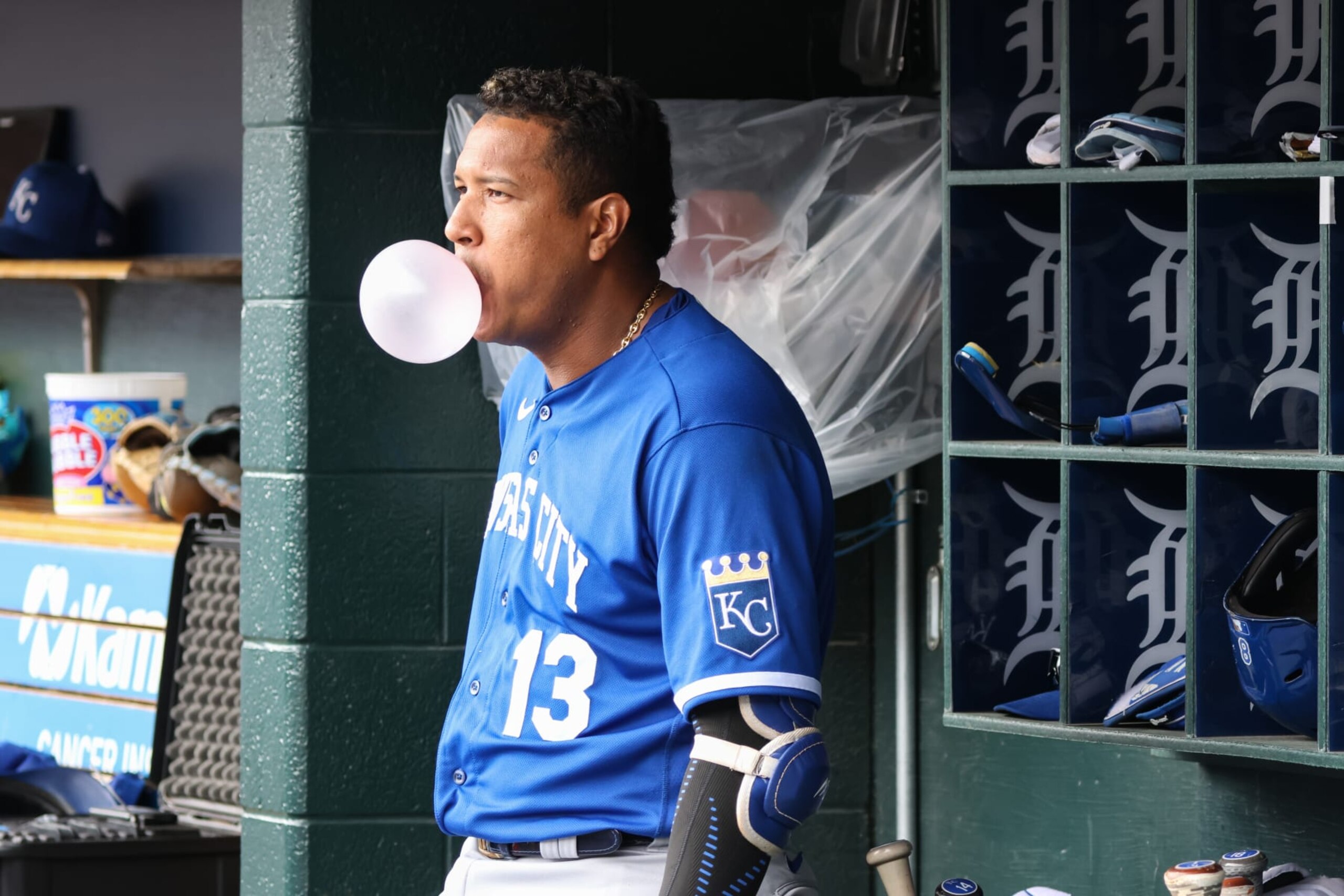 DETROIT, MI - SEPTEMBER 29:  Kansas City Royals designated hitter Salvador Perez (13) blows a bubble gum bubble as he looks on from the dugout during the first inning of a regular season Major League Baseball game between the Kansas City Royals and the Detroit Tigers on September 29, 2022 at Comerica Park in Detroit, Michigan.  (Photo by Scott W. Grau/Icon Sportswire via Getty Images)