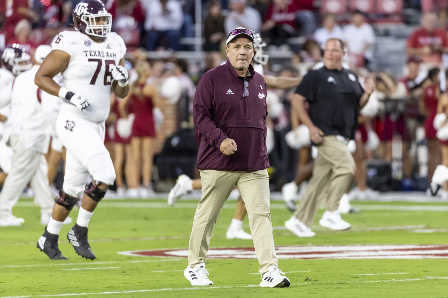 Texas A&M head coach Jimbo Fisher walks the field in warmups before an NCAA college football game against Alabama, Saturday, Oct. 8, 2022, in Tuscaloosa, Ala. (AP Photo/Vasha Hunt)