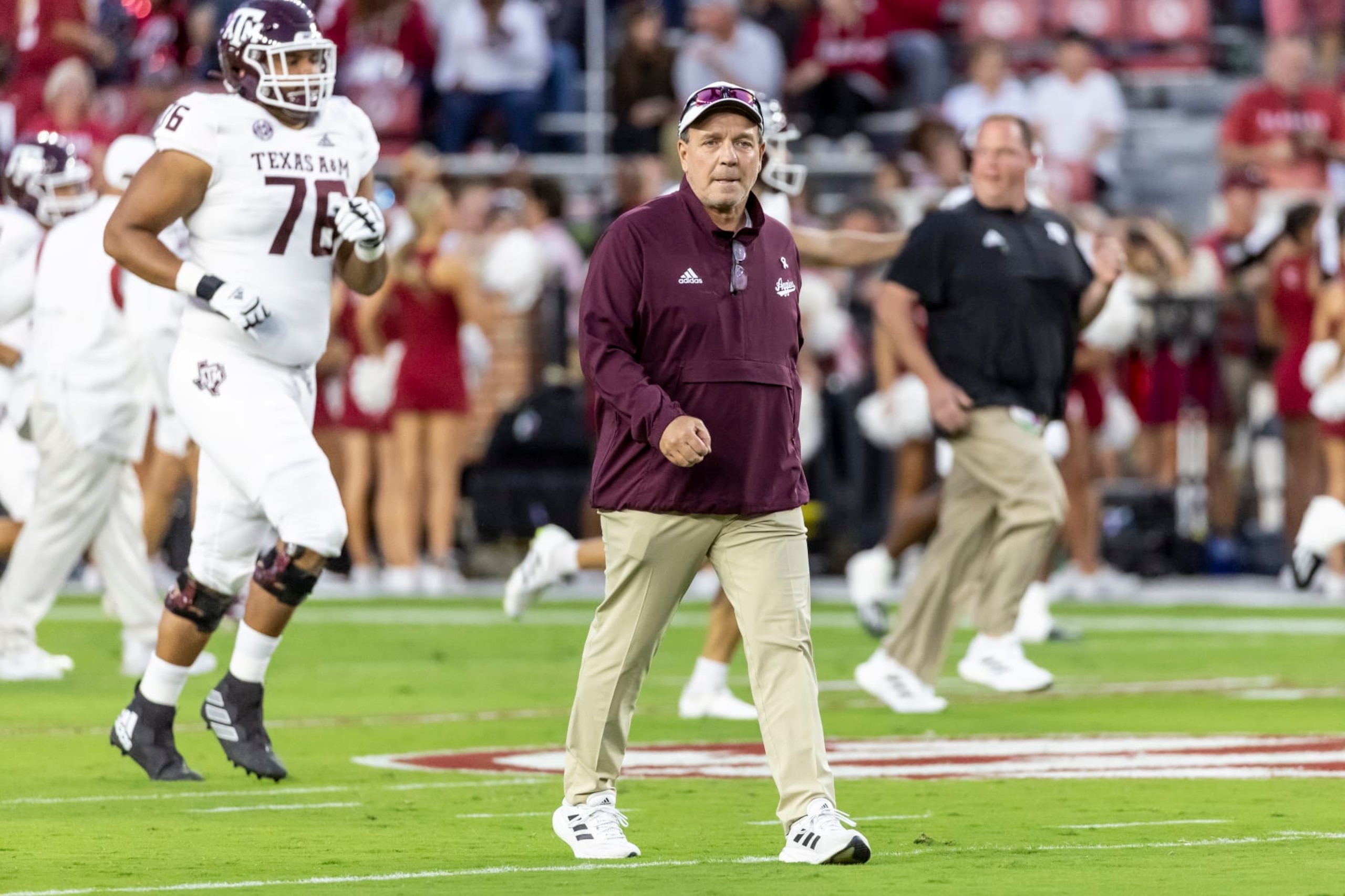 Texas A&M head coach Jimbo Fisher walks the field in warmups before an NCAA college football game against Alabama, Saturday, Oct. 8, 2022, in Tuscaloosa, Ala. (AP Photo/Vasha Hunt)