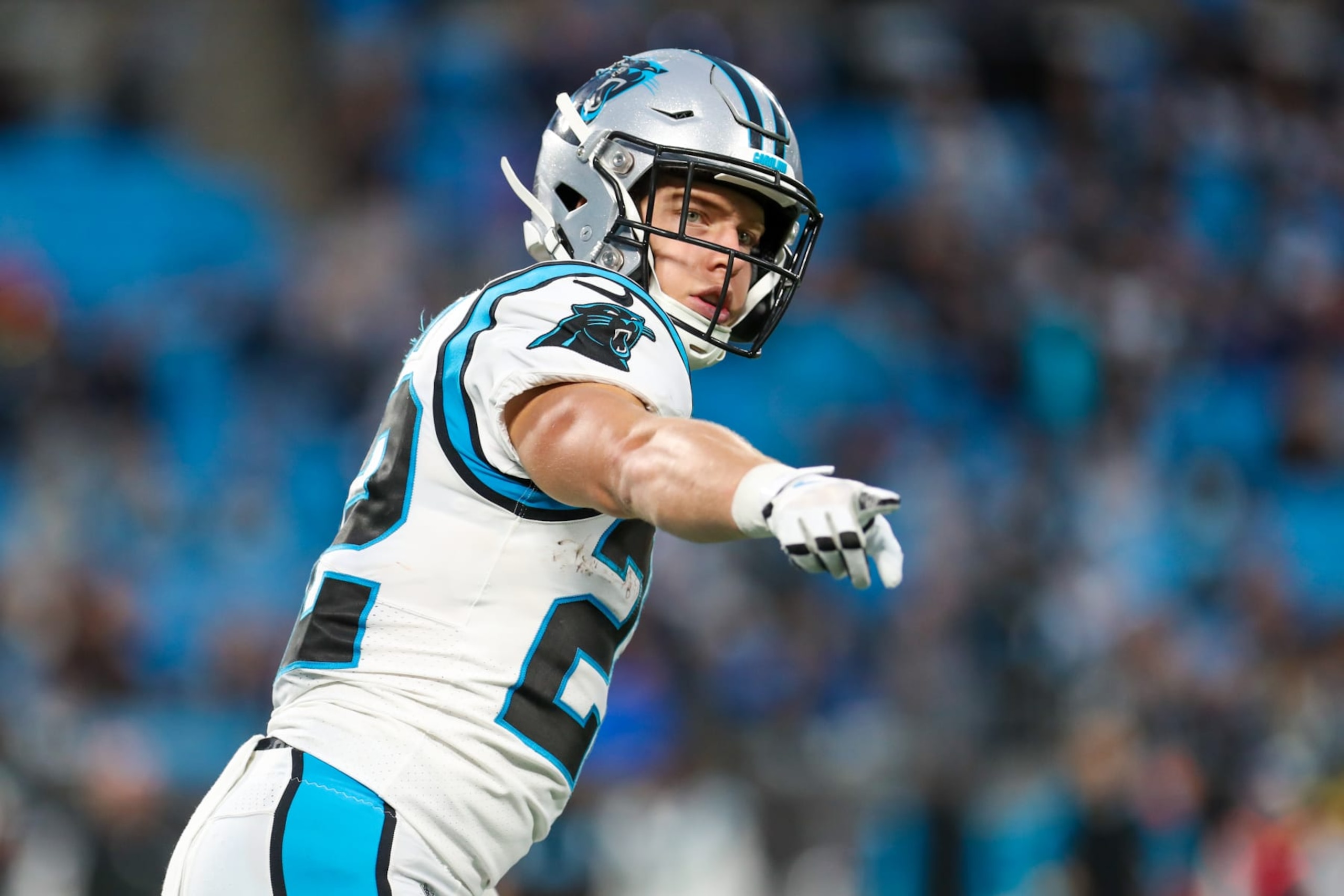 CHARLOTTE, NC - OCTOBER 02: Christian McCaffrey (22) of the Carolina Panthers points to an official on the sideline during a football game between the Carolina Panthers and the Arizona Cardinals on October 2, 2022, at Bank of America Stadium in Charlotte, NC. (Photo by David Jensen/Icon Sportswire via Getty Images)