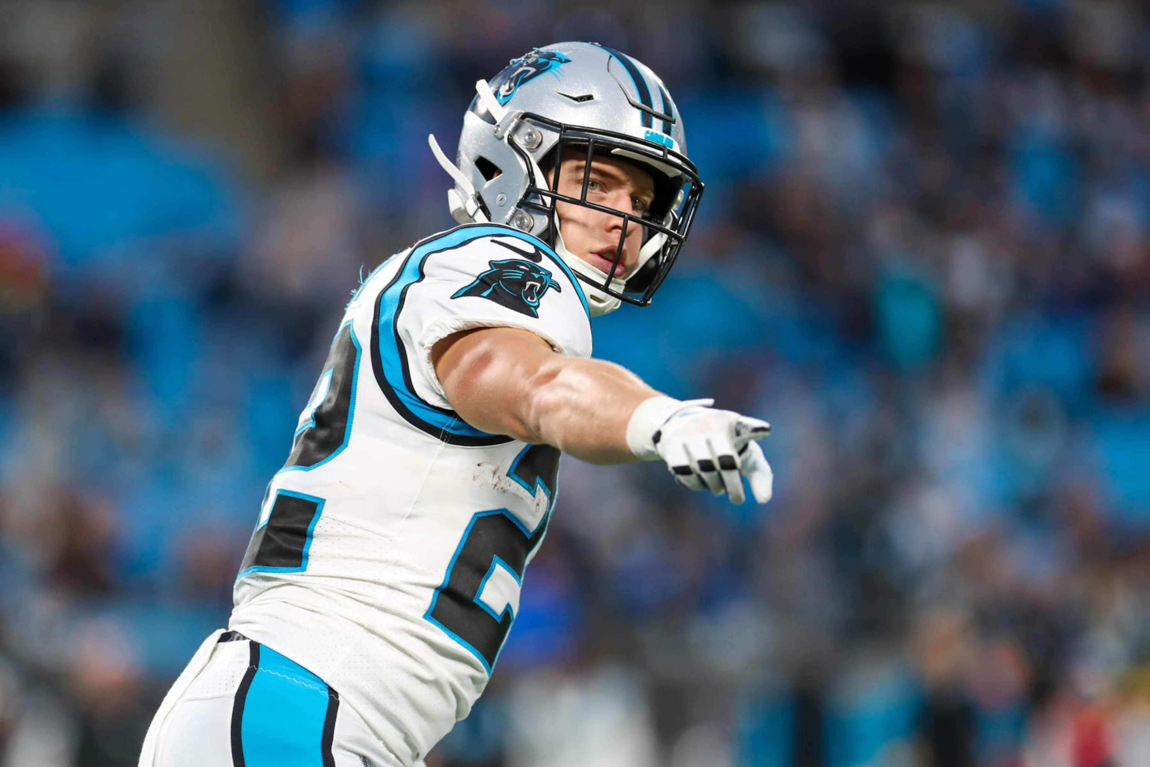 CHARLOTTE, NC - OCTOBER 02: Christian McCaffrey (22) of the Carolina Panthers points to an official on the sideline during a football game between the Carolina Panthers and the Arizona Cardinals on October 2, 2022, at Bank of America Stadium in Charlotte, NC. (Photo by David Jensen/Icon Sportswire via Getty Images)