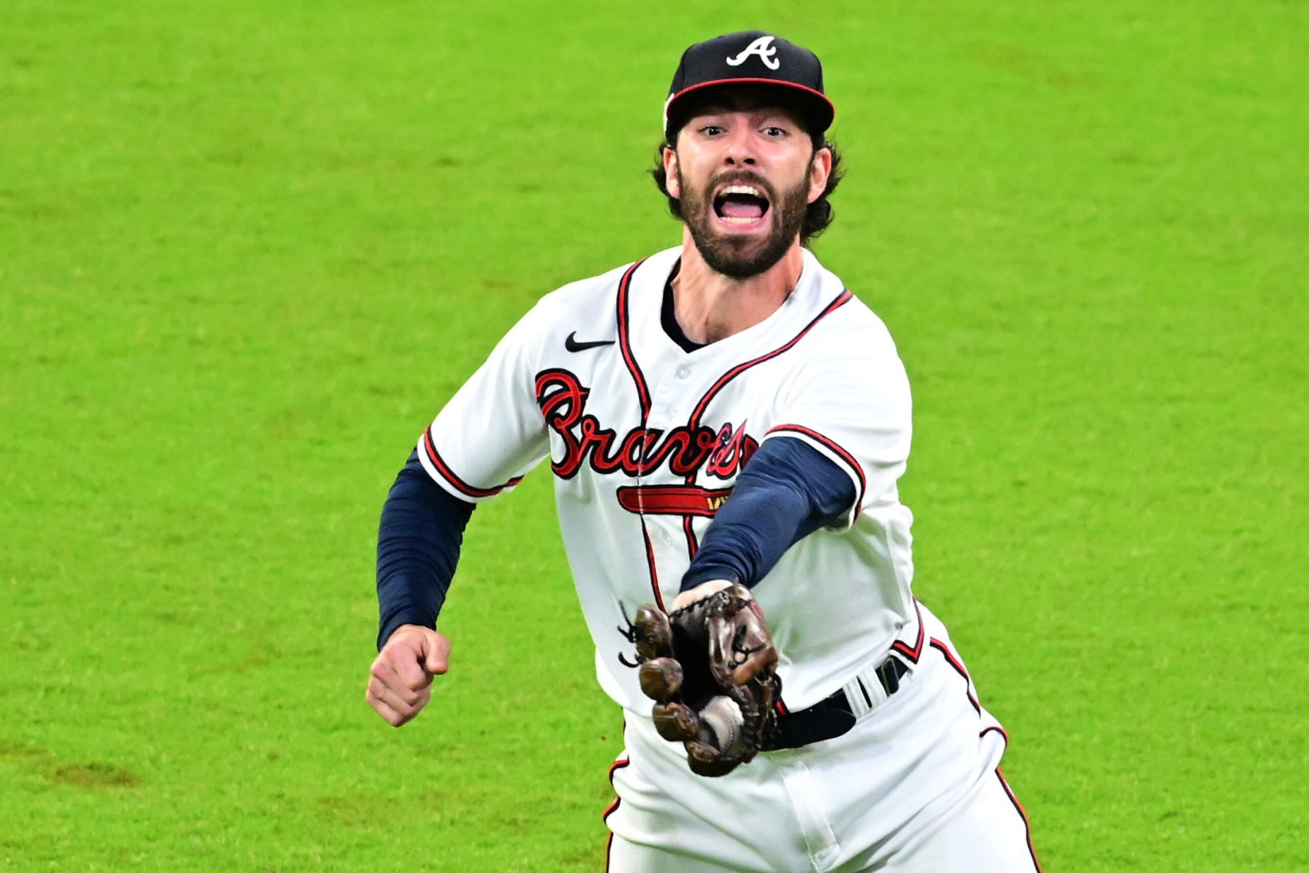 ATLANTA, GEORGIA - OCTOBER 12: Dansby Swanson #7 of the Atlanta Braves catches an out against the Philadelphia Phillies during the sixth inning in game two of the National League Division Series at Truist Park on October 12, 2022 in Atlanta, Georgia. (Photo by Adam Hagy/Getty Images)