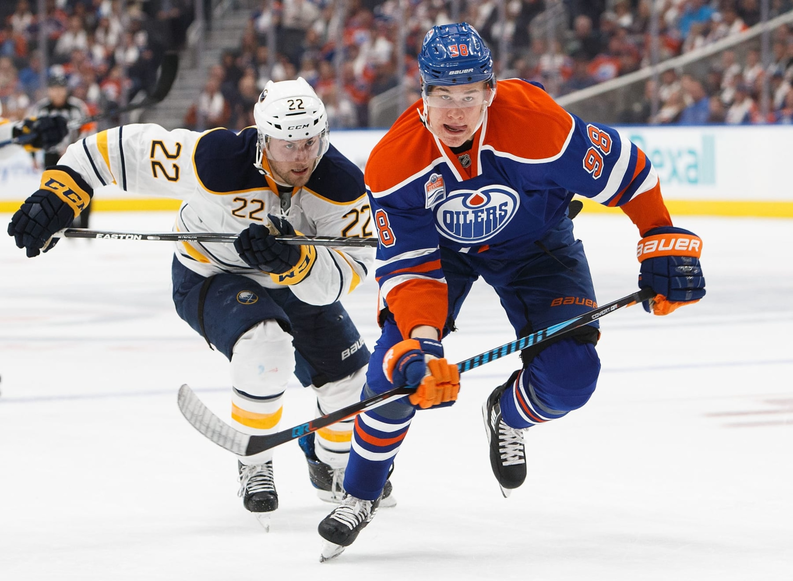 EDMONTON, AB - OCTOBER 16:  Jesse Puljujarvi #98 of the Edmonton Oilers is pursued by Johan Larsson #22 of the Buffalo Sabres on October 16, 2016 at Rogers Place in Edmonton, Alberta, Canada. (Photo by Codie McLachlan/Getty Images)