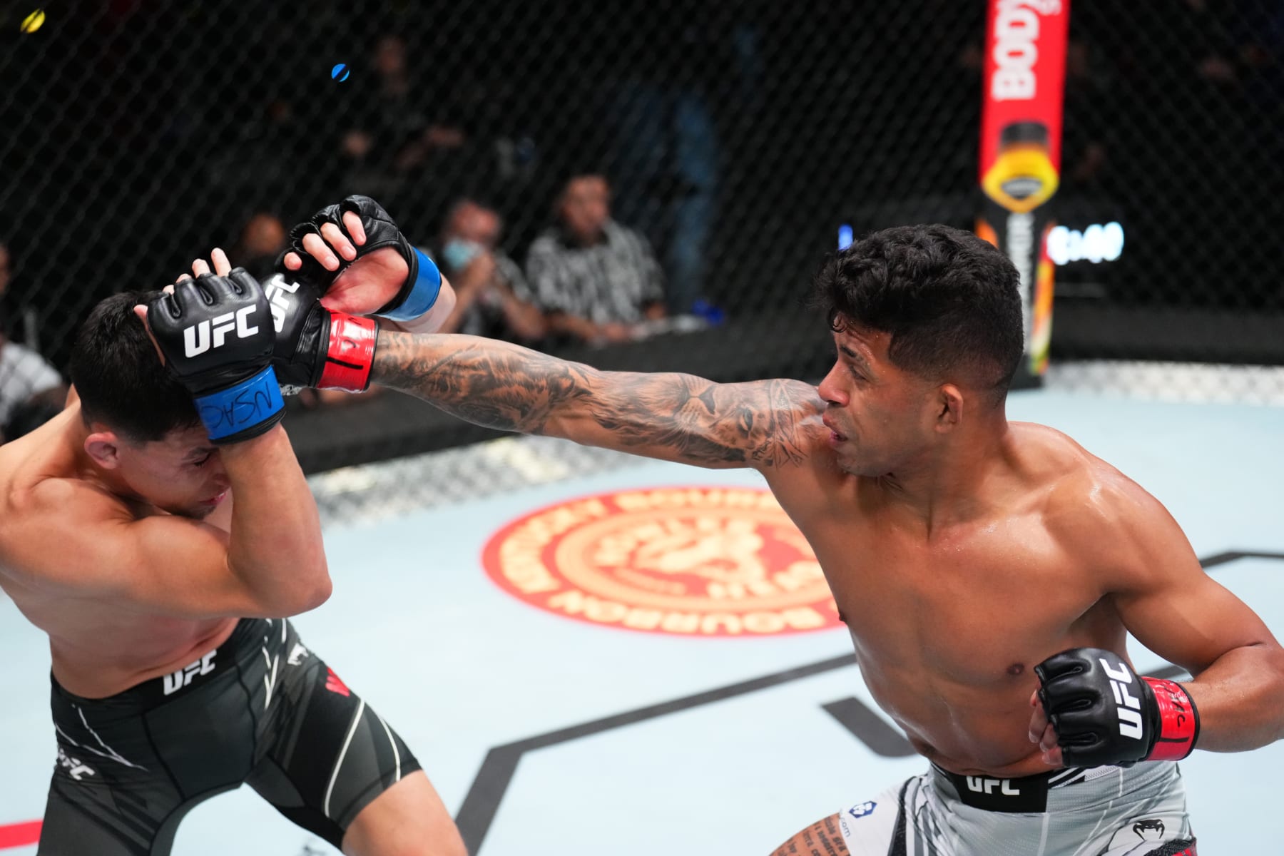 LAS VEGAS, NEVADA - MAY 21: (R-L) Jonathan Martinez punches Vince Morales in a bantamweight bout during the UFC Fight Night event at UFC APEX on May 21, 2022 in Las Vegas, Nevada. (Photo by Chris Unger/Zuffa LLC)