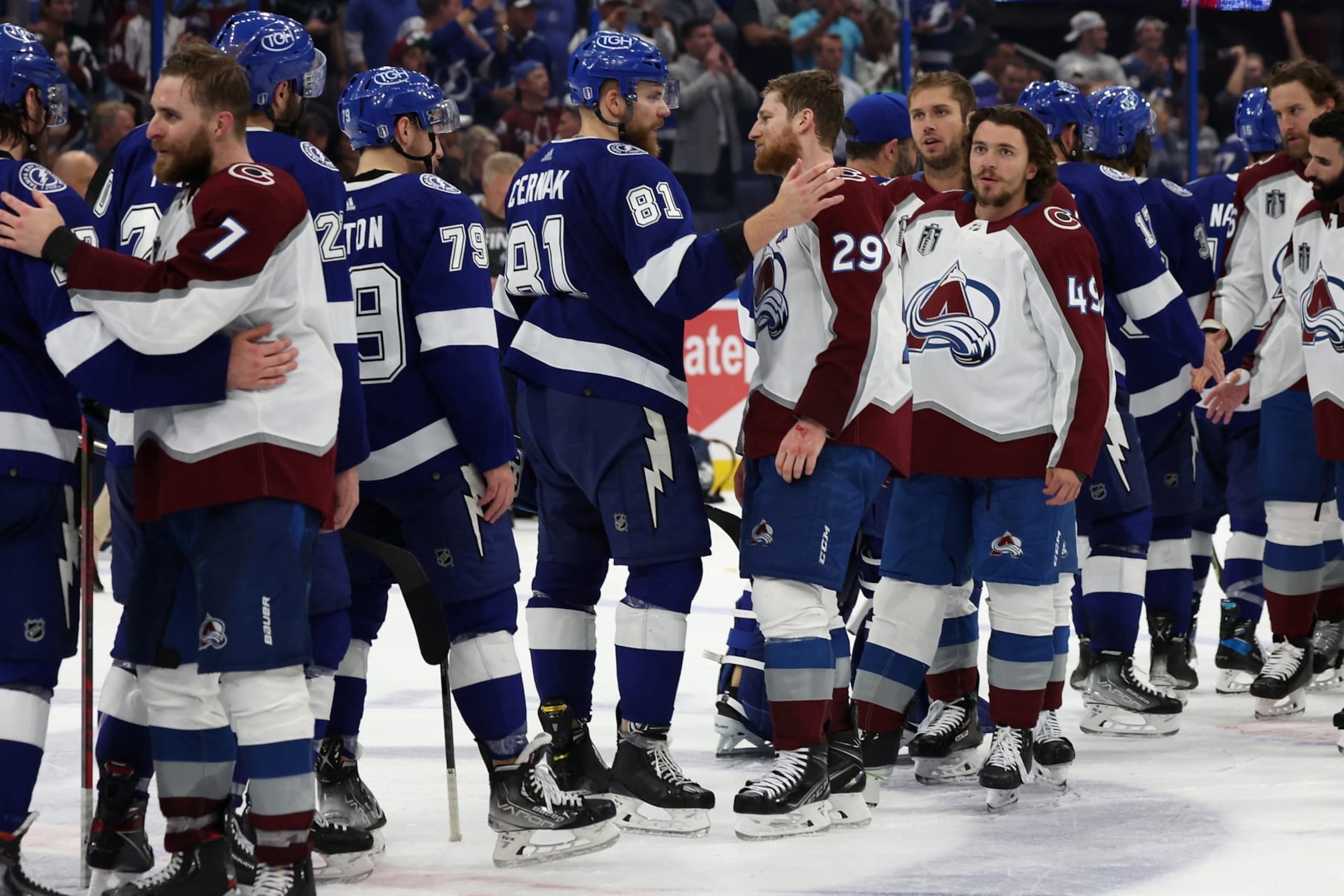 TAMPA, FLORIDA - JUNE 26:  Nathan MacKinnon #29 of the Colorado Avalanche shakes hands with Erik Cernak #81 of the Tampa Bay Lightning following Game Six of the 2022 NHL Stanley Cup Final at Amalie Arena on June 26, 2022 in Tampa, Florida. The Avalanche defeated the Lightning 2-1.  (Photo by Christian Petersen/Getty Images)