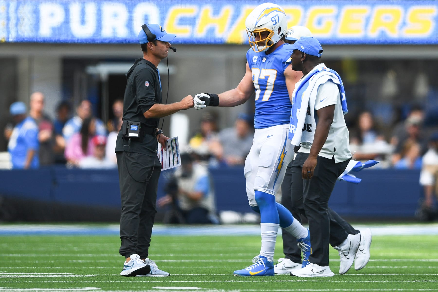 INGLEWOOD, CA - SEPTEMBER 25: Los Angeles Chargers head coach Brandon Staley gives Los Angeles Chargers defensive end Joey Bosa (97) as he walks off the field with an injury the NFL regular season game between the Jacksonville Jaguars and the Los Angeles Chargers on September 25, 2022, at SoFi Stadium in Inglewood, CA. (Photo by Brian Rothmuller/Icon Sportswire via Getty Images)